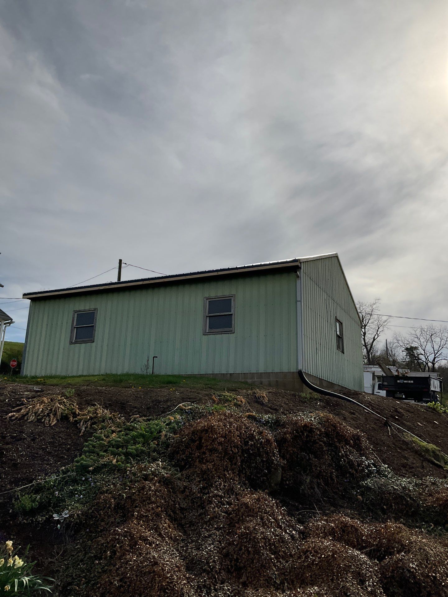 3-Car Garage refresh Blue Metal Roofing in Herndon by Esh Builders