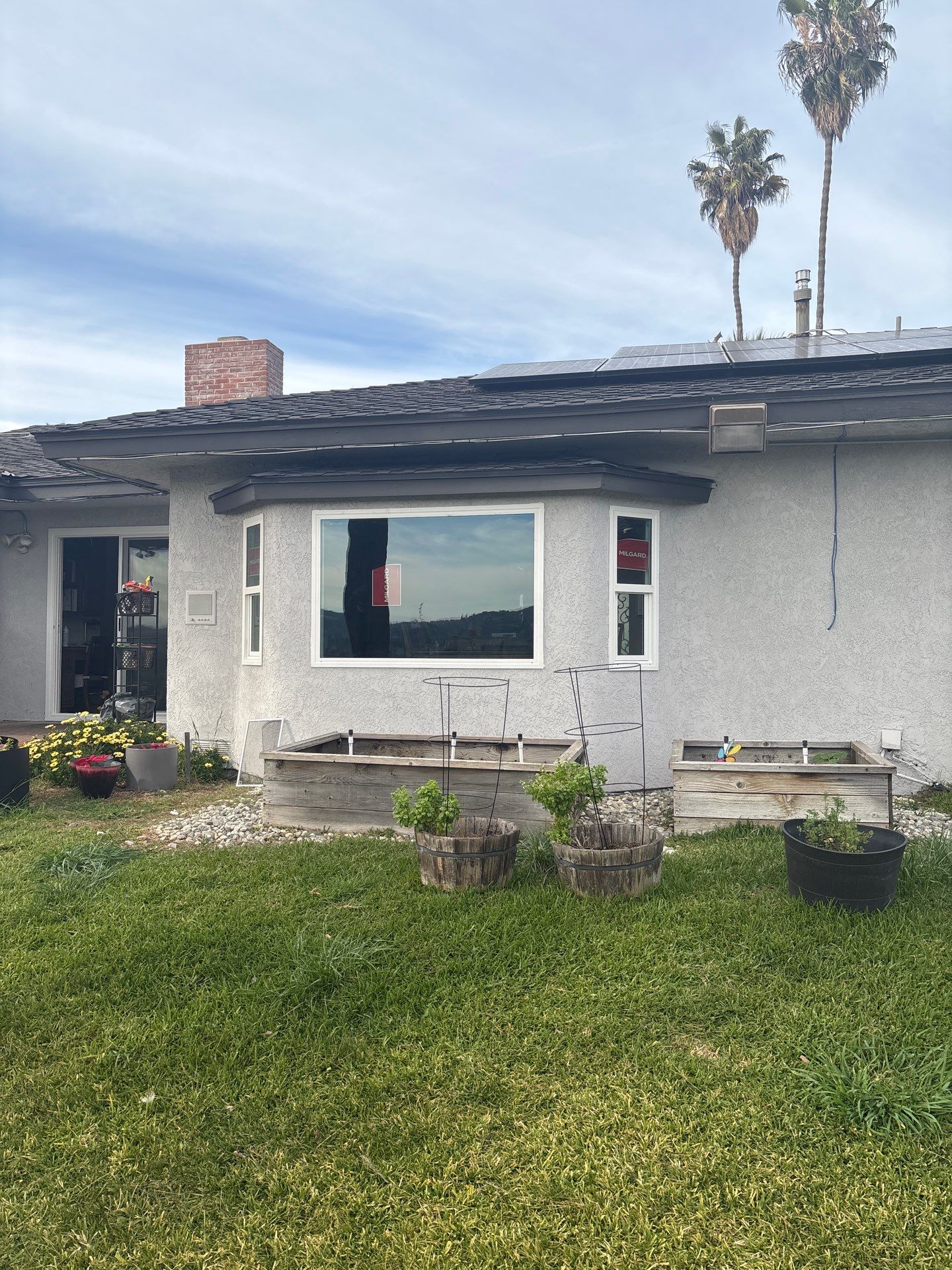 New Dark Frame Milgard Window and Sliding Door Installation in Covina by American Window Company