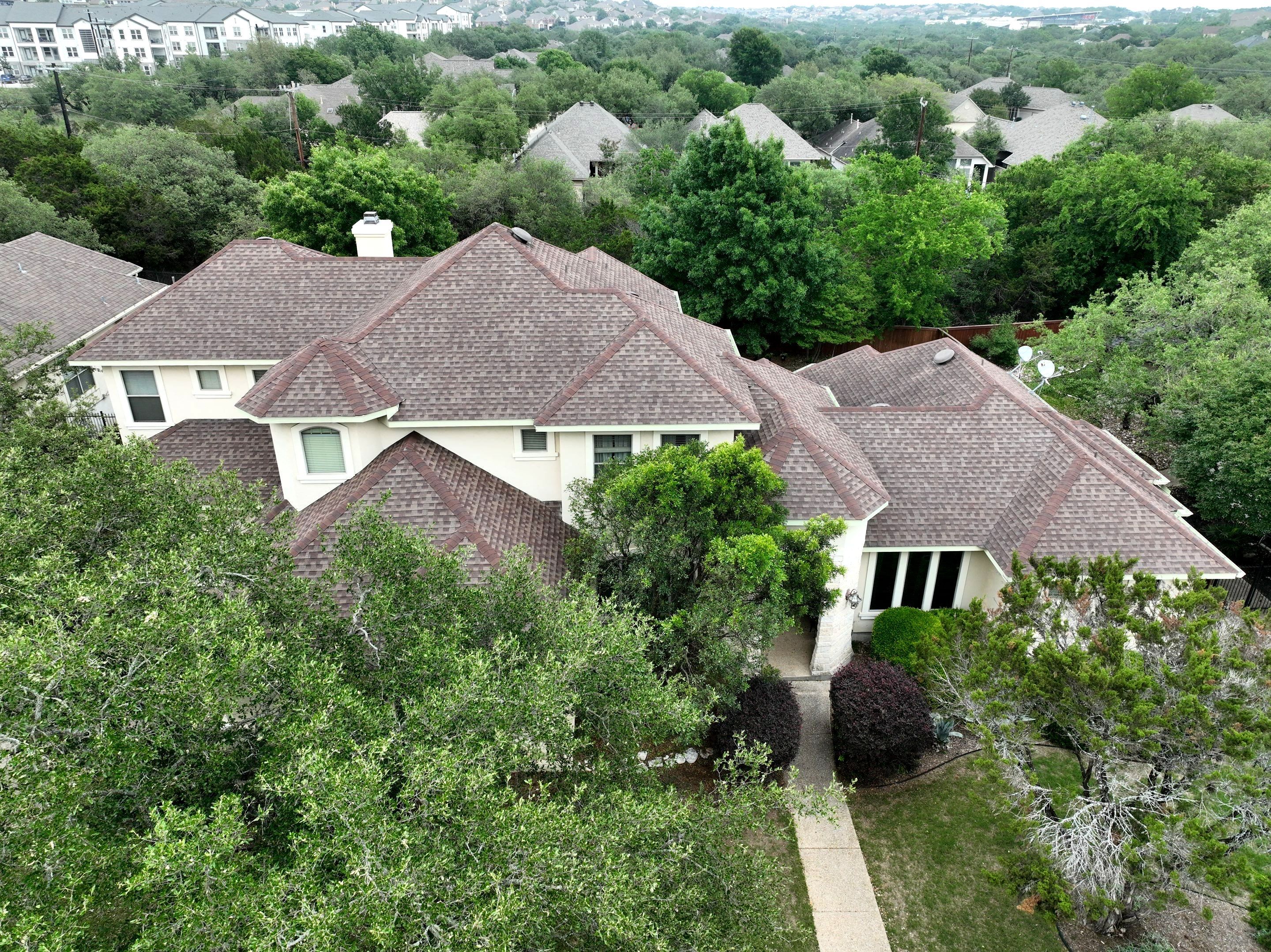 Residential Roof Replacement using 30 Year Laminate Shingles with High Profile Ridge by Premier Roofing and Contracting