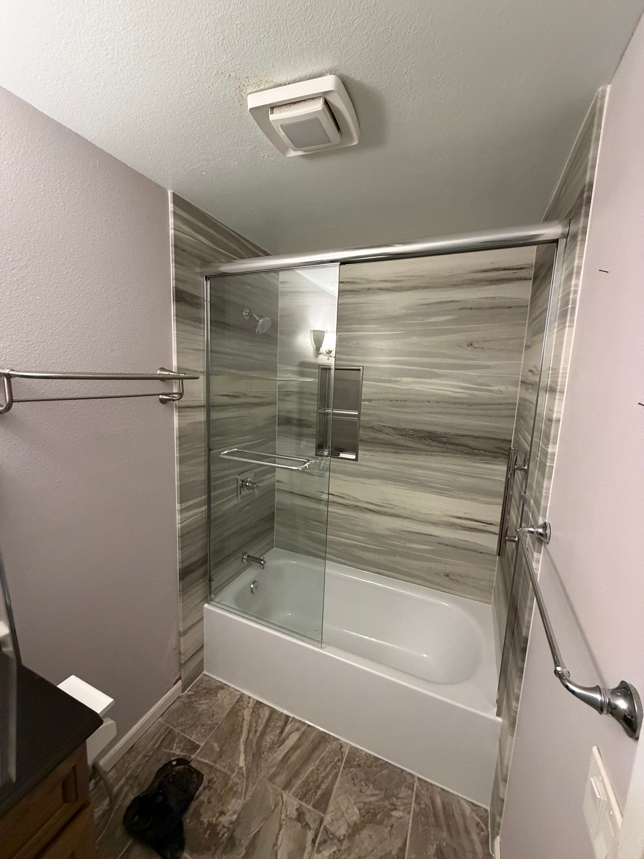 San Diego in Mira Mesa Modern Bathtub Replacement and Marble Wall Panel Installation by California Bathrooms, Inc