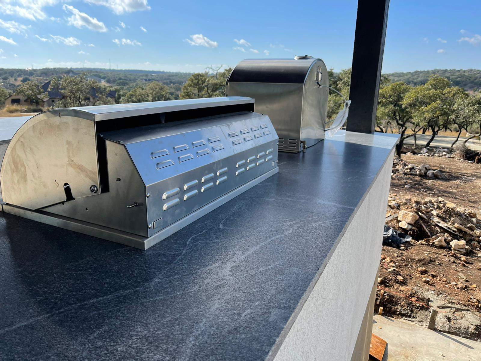 Outdoor kitchen using Black mist honed granite by Mena stone surfaces