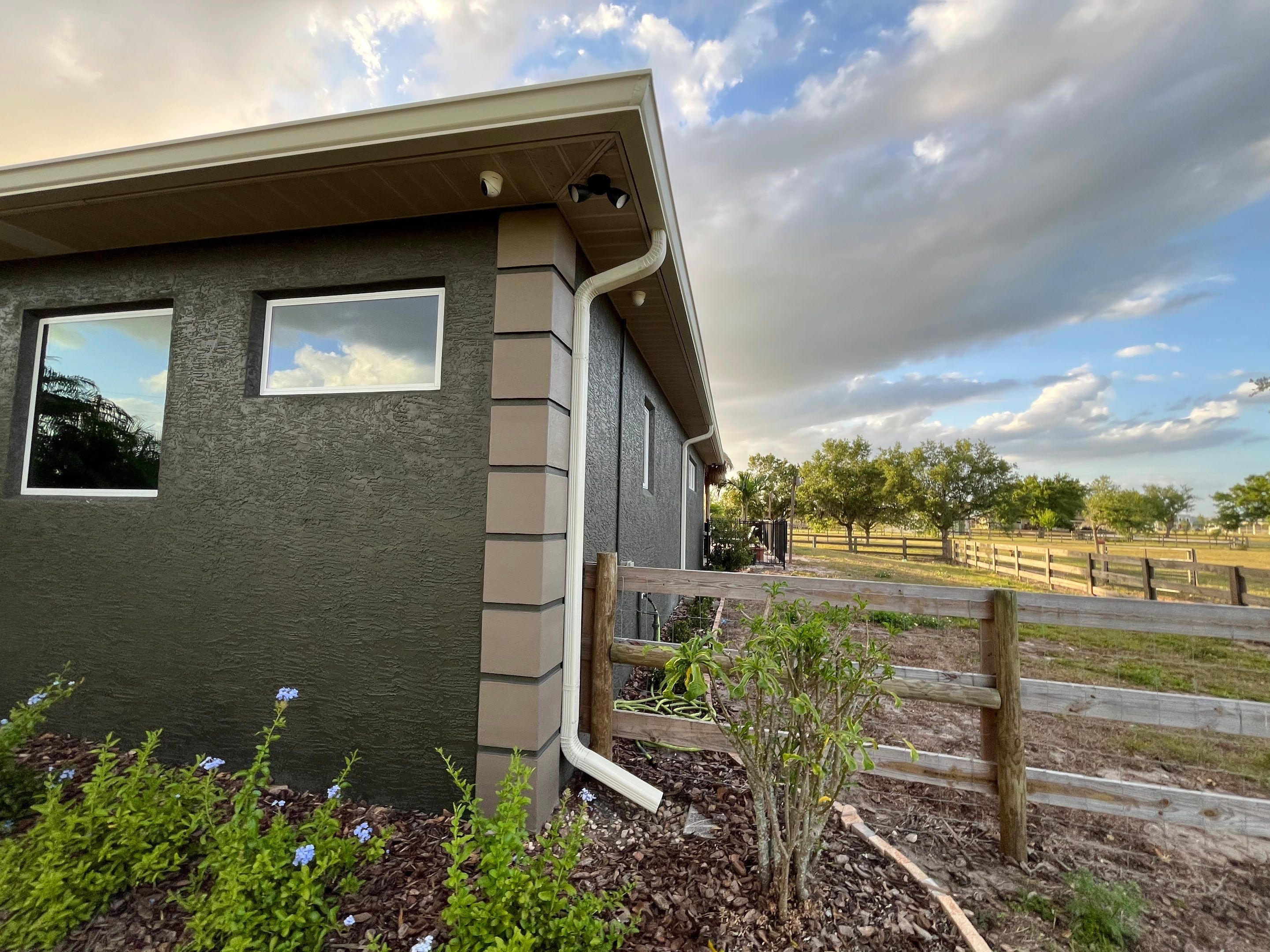  7-inch White seamless gutters and downspouts in Myakka City FL by Gutter Professors