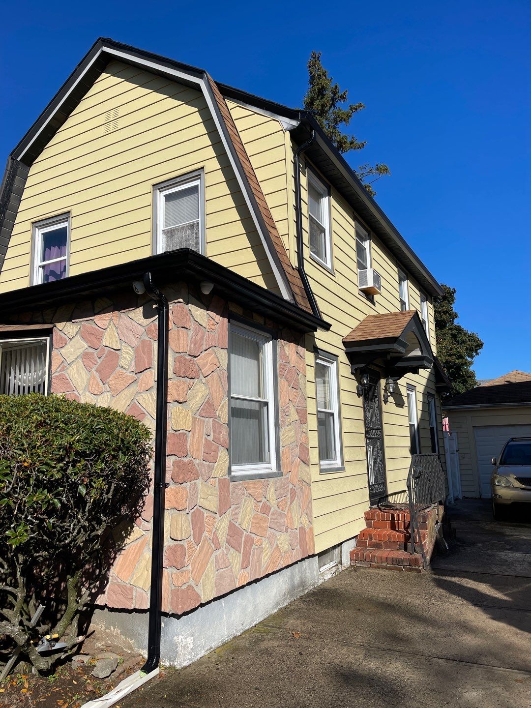 Full House Installation 5" black seamless gutters and 2x3 leaders using 5" black K style seamless gutters and 2x3 black leaders by Above All Gutters
