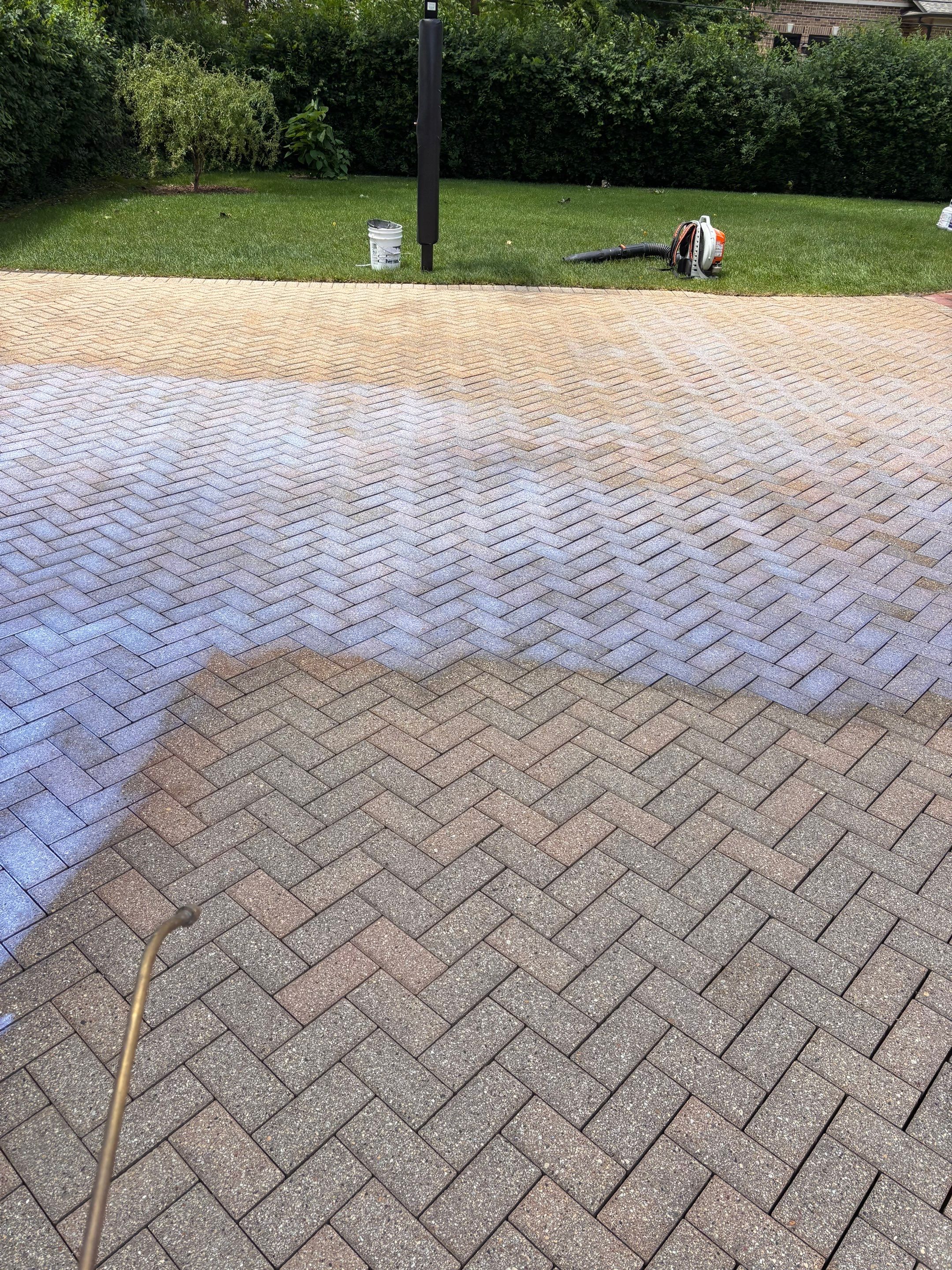Brick paver repair, cleaning and sealing by Northern Power Washing LLC.