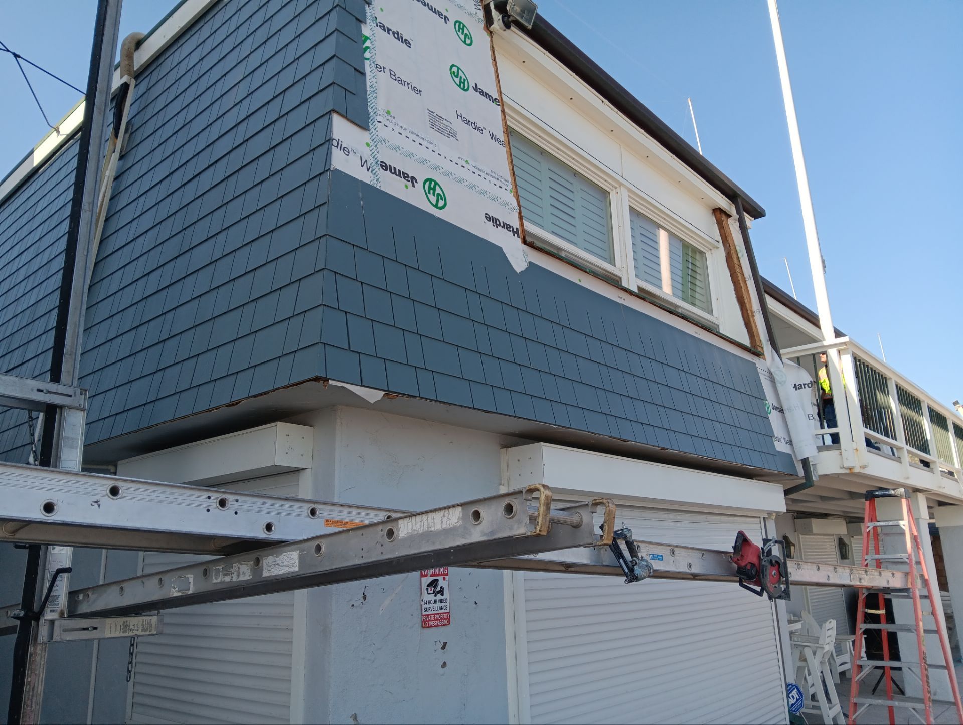 Pre-finish shingles by New Era Siding Inc 