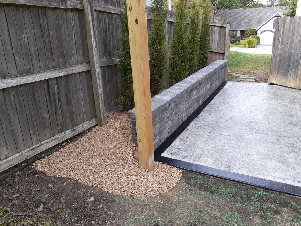 Back Yard Stamped Concrete Patio by LAND ESCAPES LLC