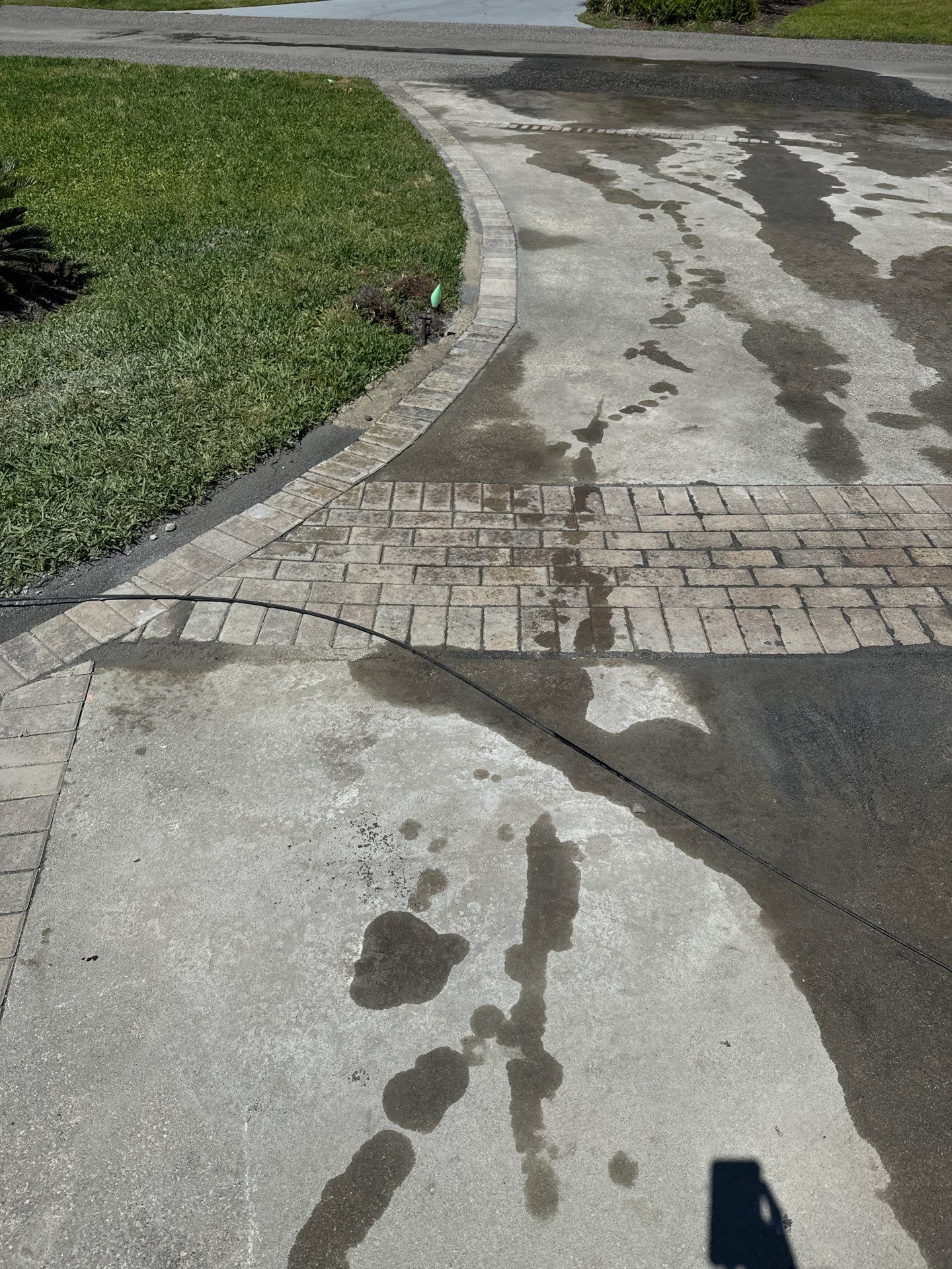 Concrete Driveway Repair with Decorative Paver Accents in Hilton Head Island by Lowcountry Scapes, LLC