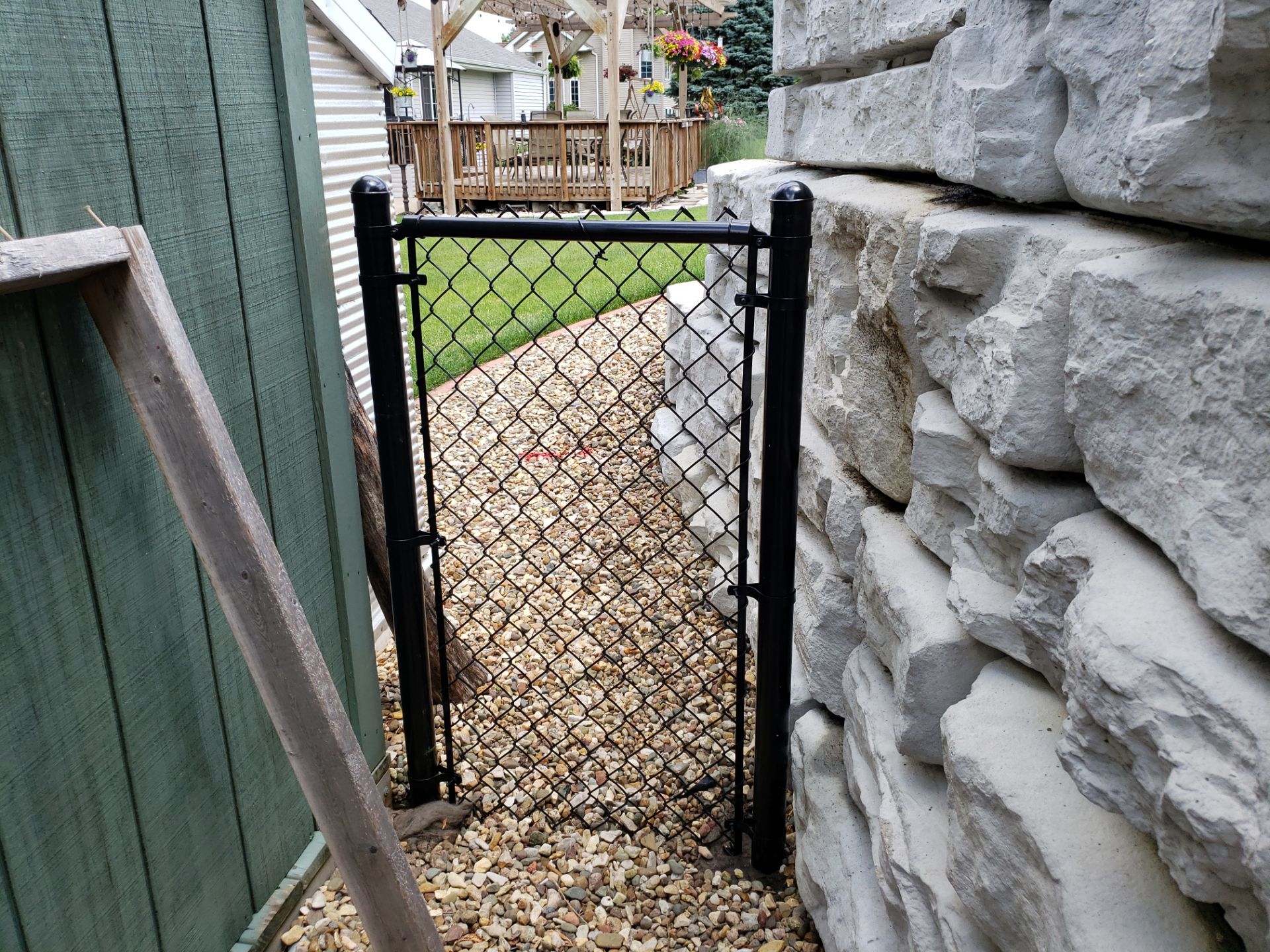 Black Vinyl-Coated Chain Link Fence Installation in Denver by Perfect Picket Fence and Stain