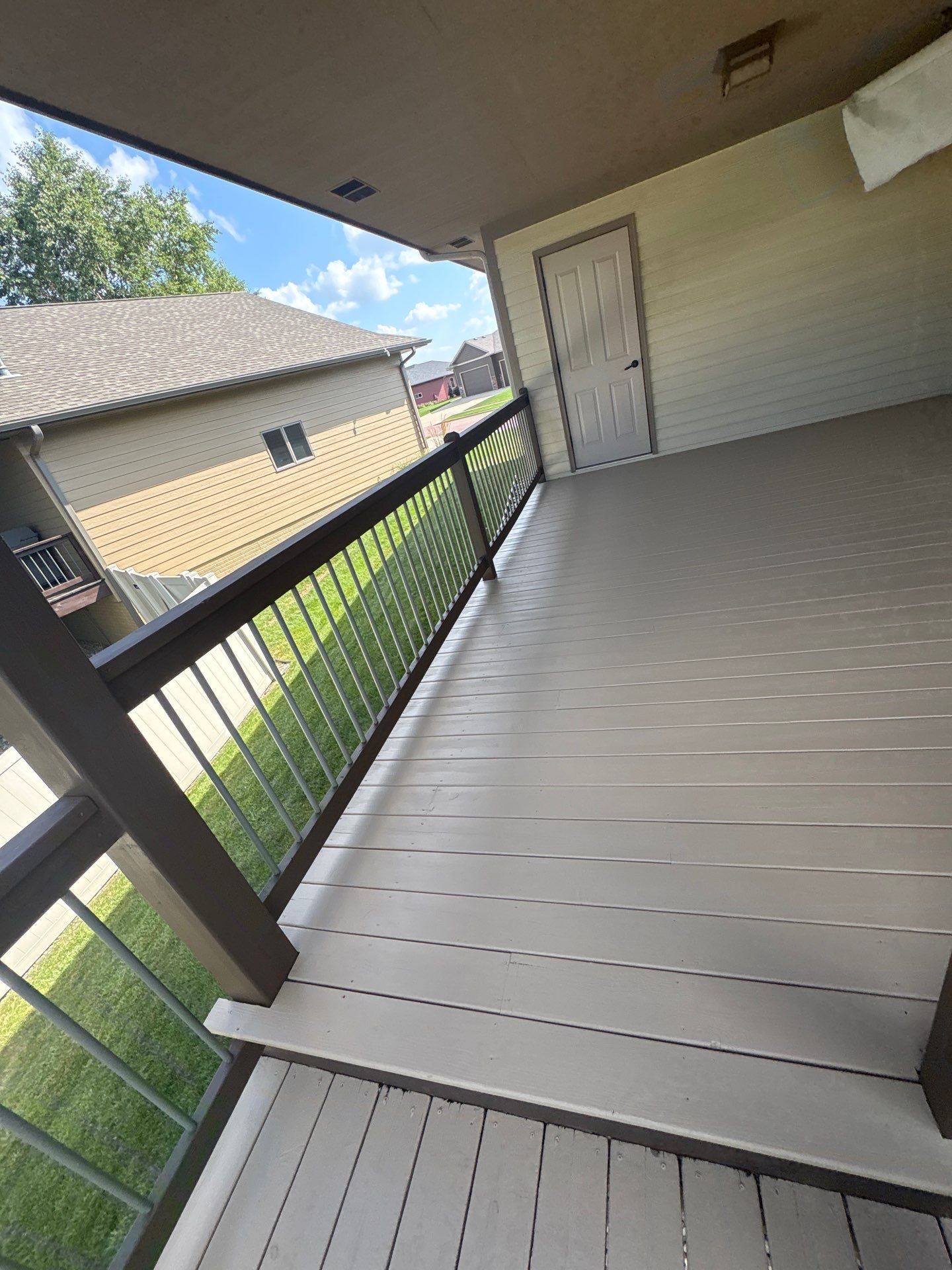 Sioux Falls Exterior Refresh and Multi-Level Deck Maintenance by Select Painting, Coatings & Garage Cabinets