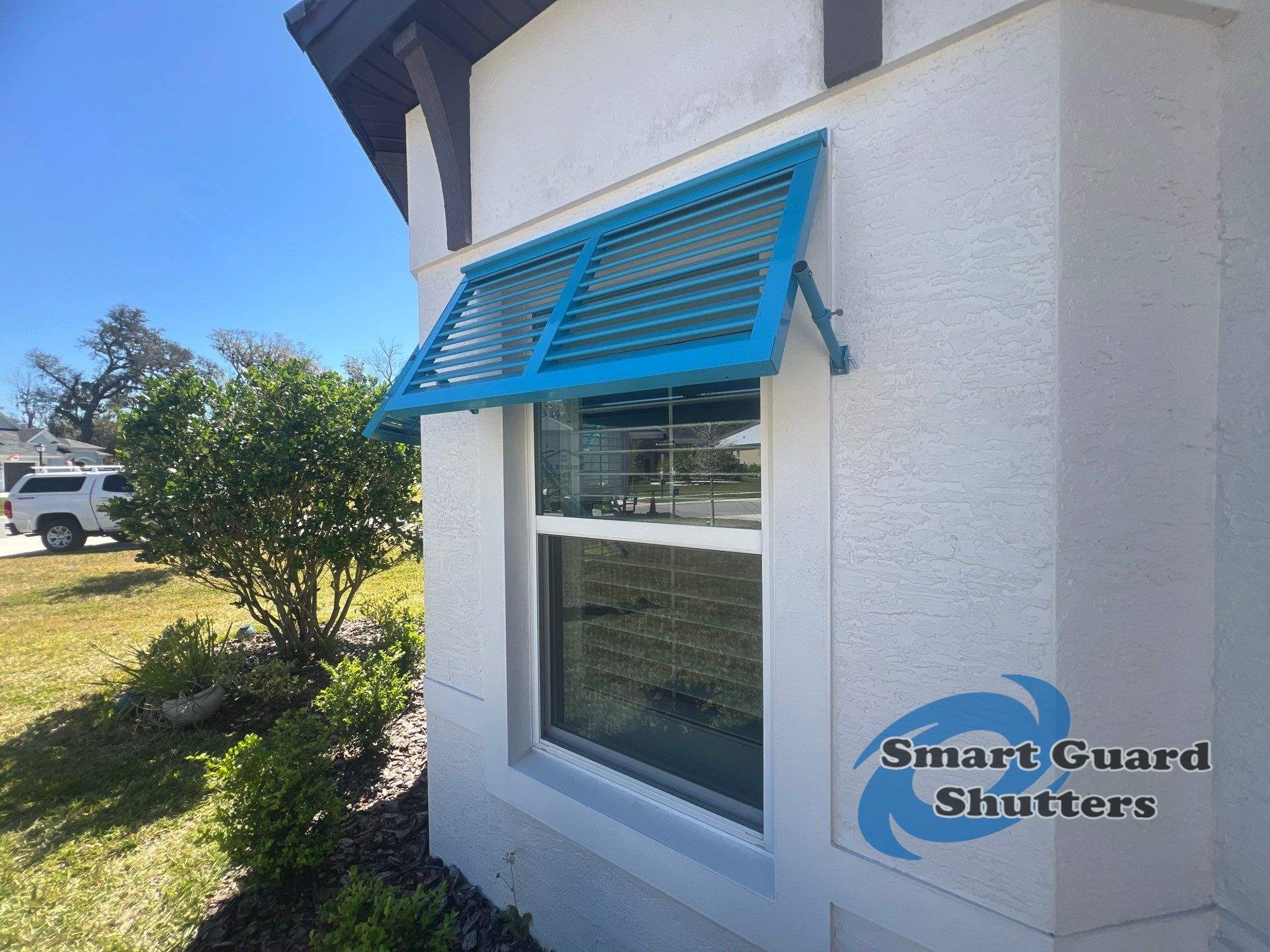 Decorative Bahamas in Throw Back Blue  by Smart Guard Shutters