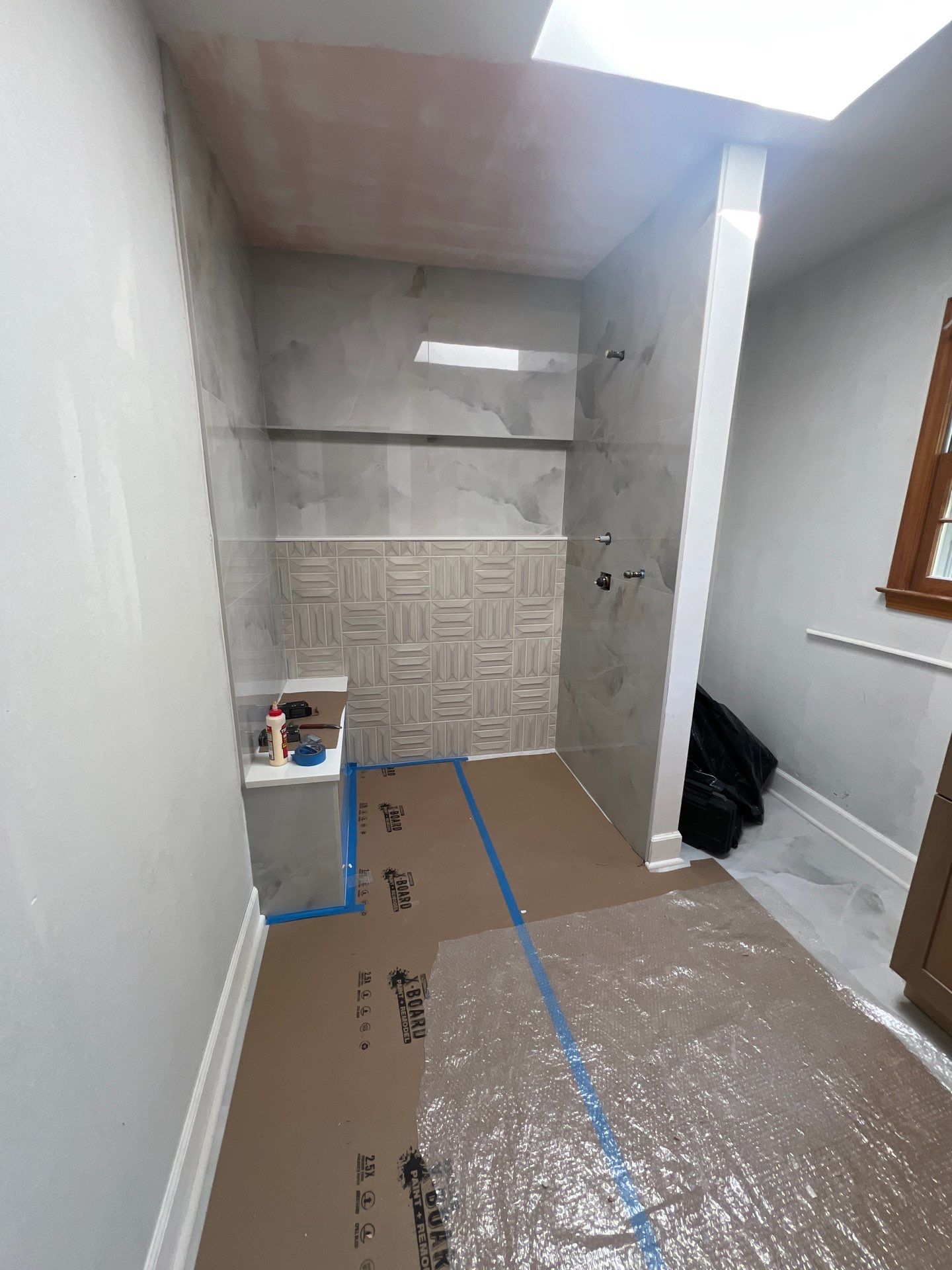 Modern Bathroom Remodeling Featuring Marble Tiles and Custom Cabinetry in Smyrna by Swift Home Renovations