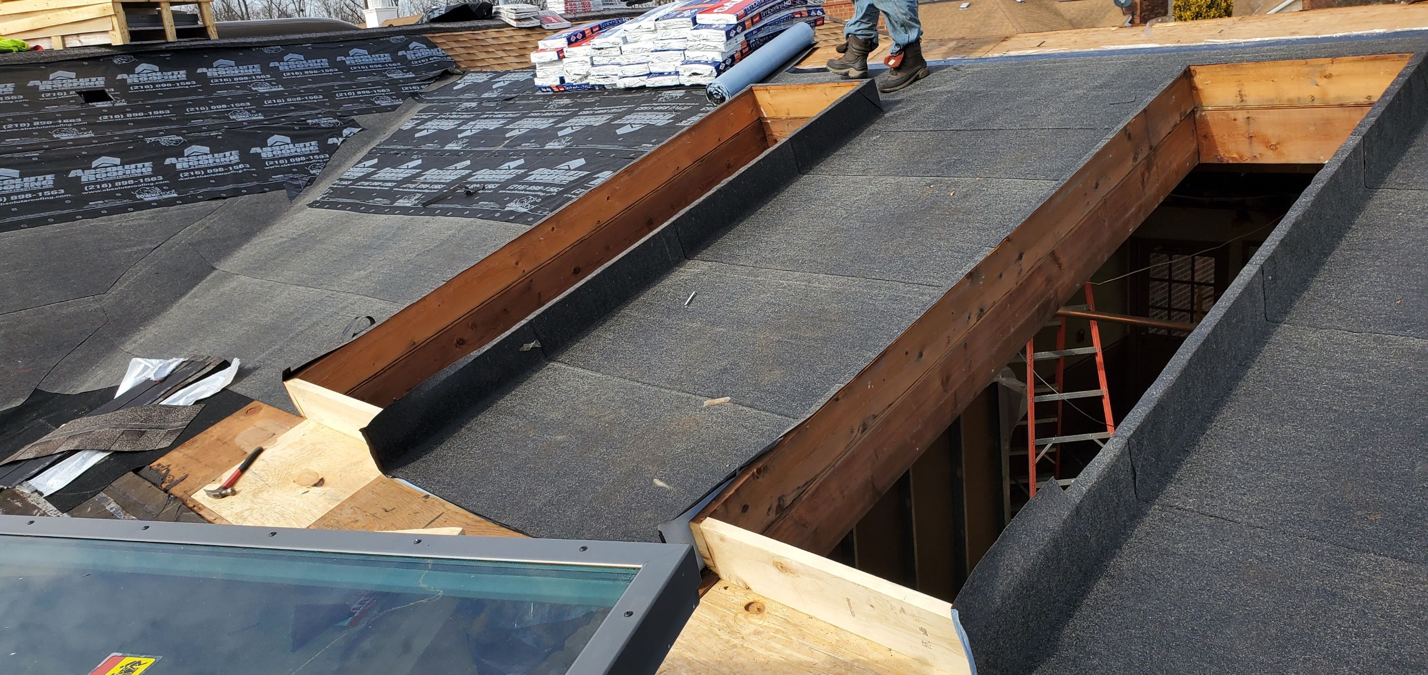 Skylight removal and install  by Absolute Roofing and Construction