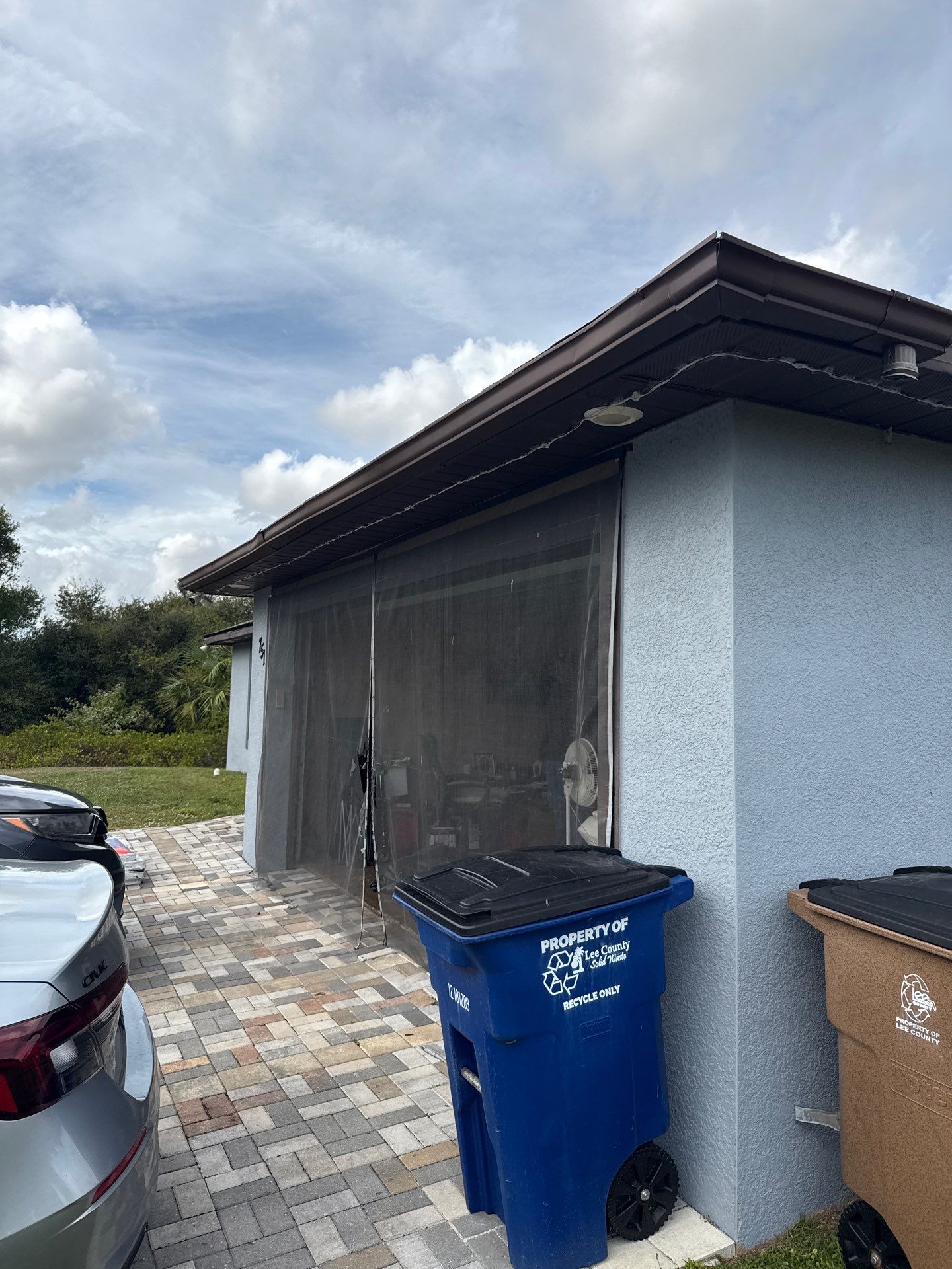 Black Seamless Gutters & Soffit/Fascia in Lehigh Acres FL by Gutter Professors