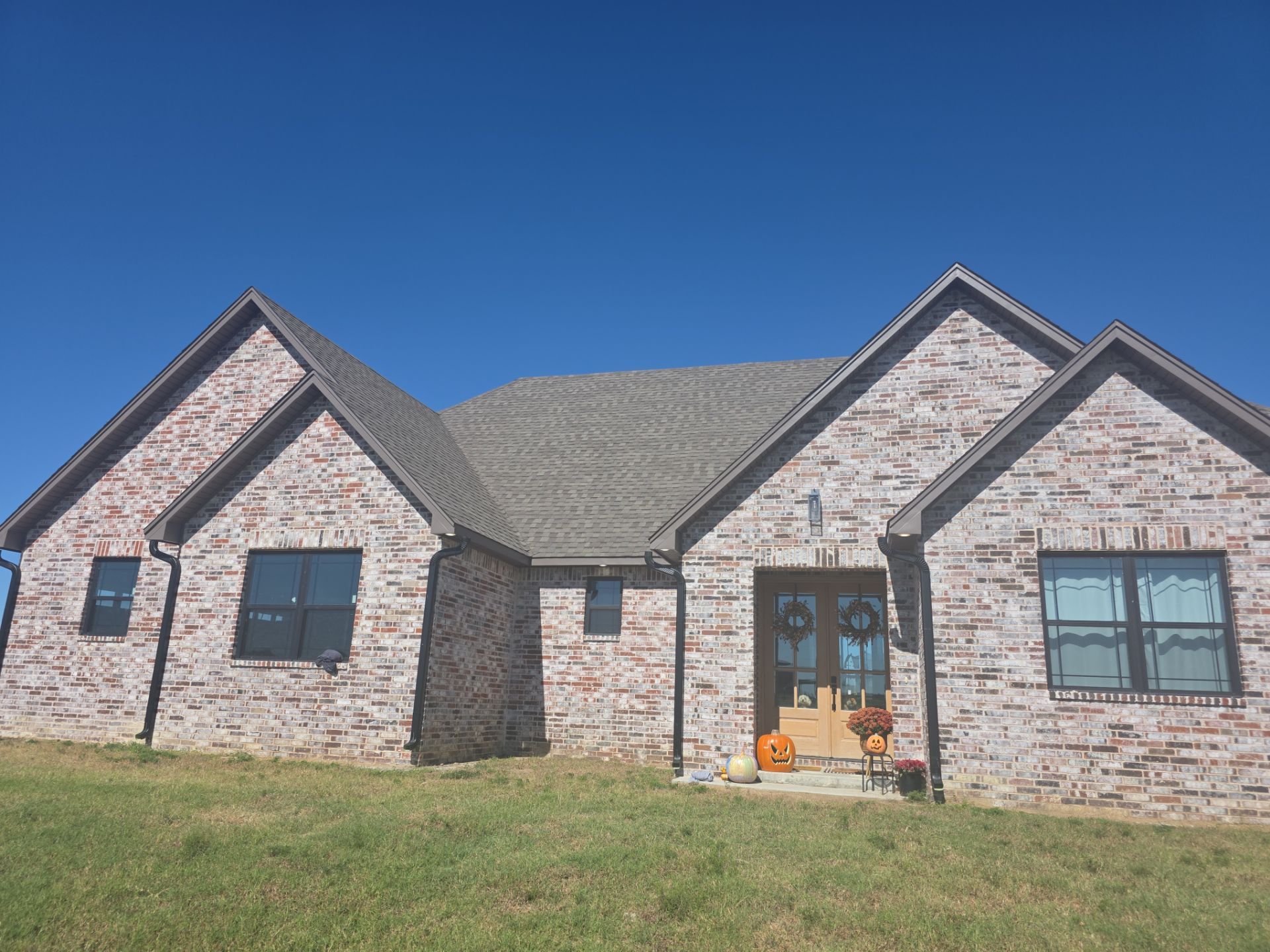 Fascia and door frames wrapped with PVC coil & soffit installation by In & Out Construction & Remodeling, LLC