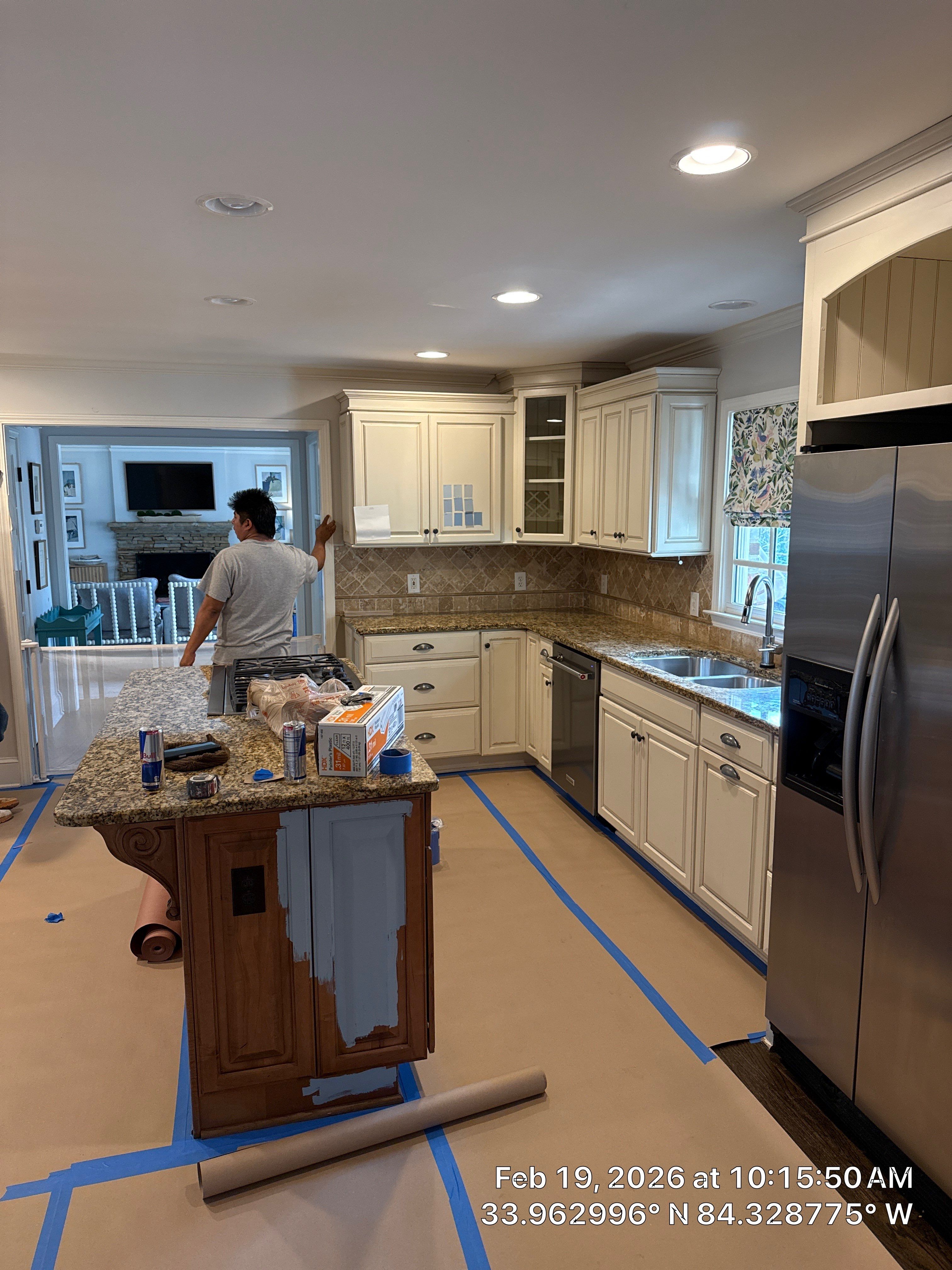Kitchen Remodel in Dunwoody Featuring White Cabinetry and Blue Island by Heart & Home Kitchen & Bath Remodeling LLC