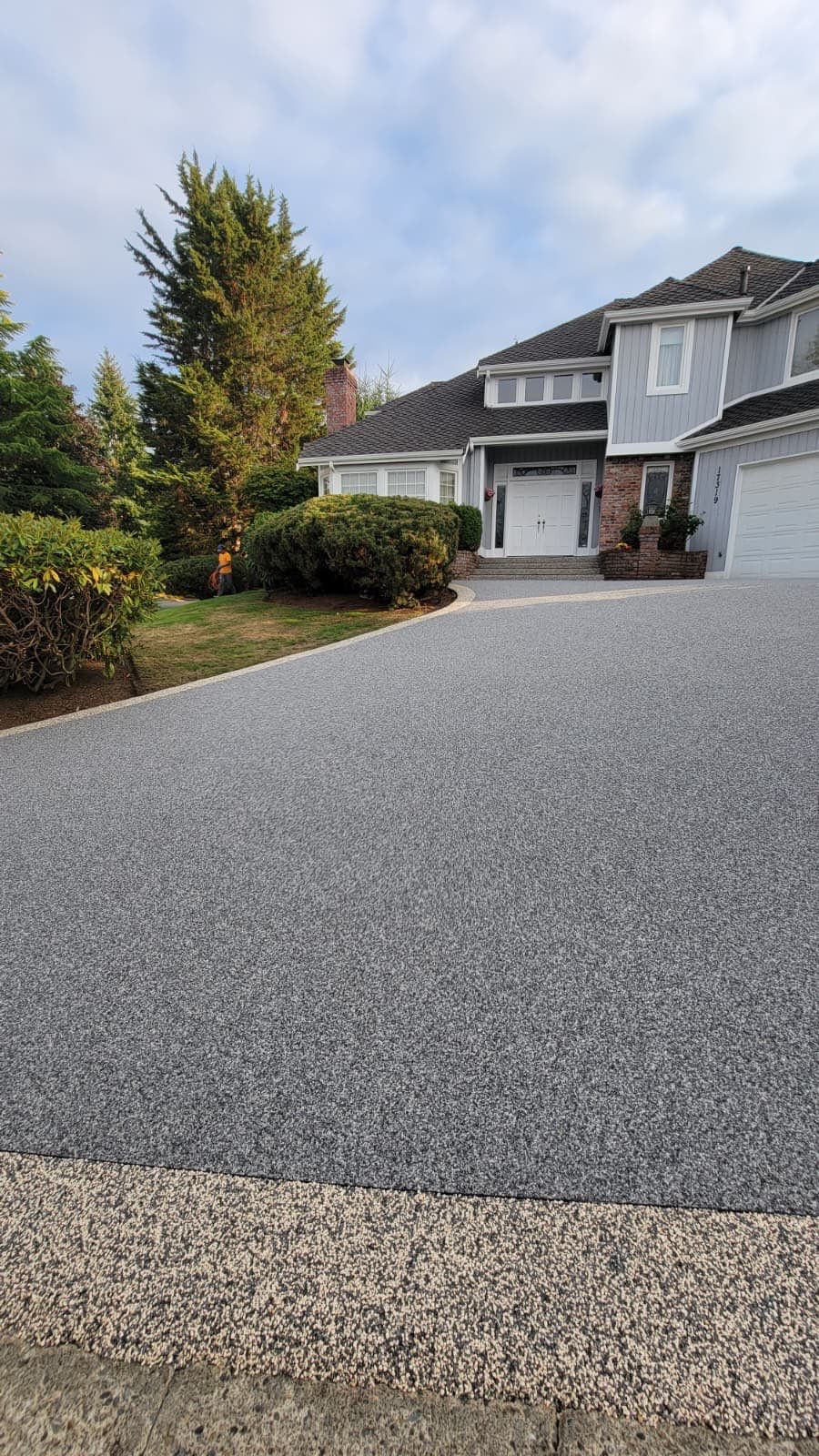 Elegant Driveway and Patio in Palazzo Vuba Stone by Concrete Coating Experts Inc.