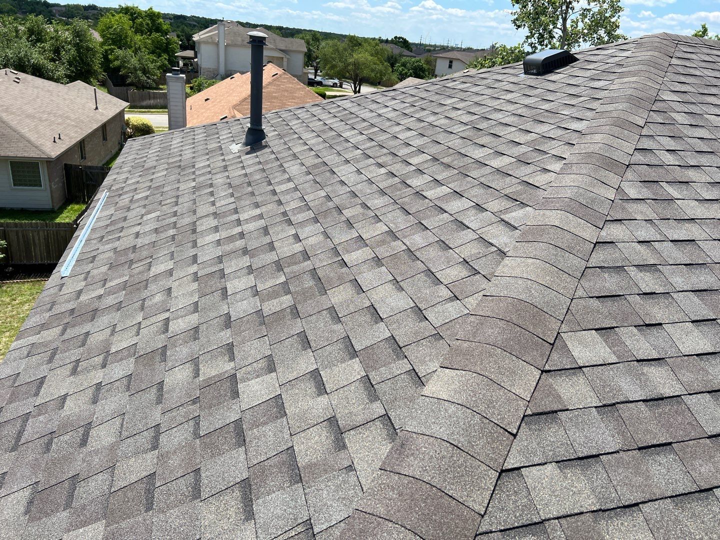 Wind damaged roof replacement by Oakwood Roofing and Construction, LLC