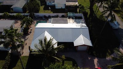 Residential Roofing Installation using 1" Nail strip metal roof