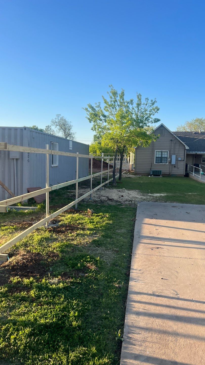 Cedar Fence using Cedar Pickets and Metal Poles by Clays Services Inc