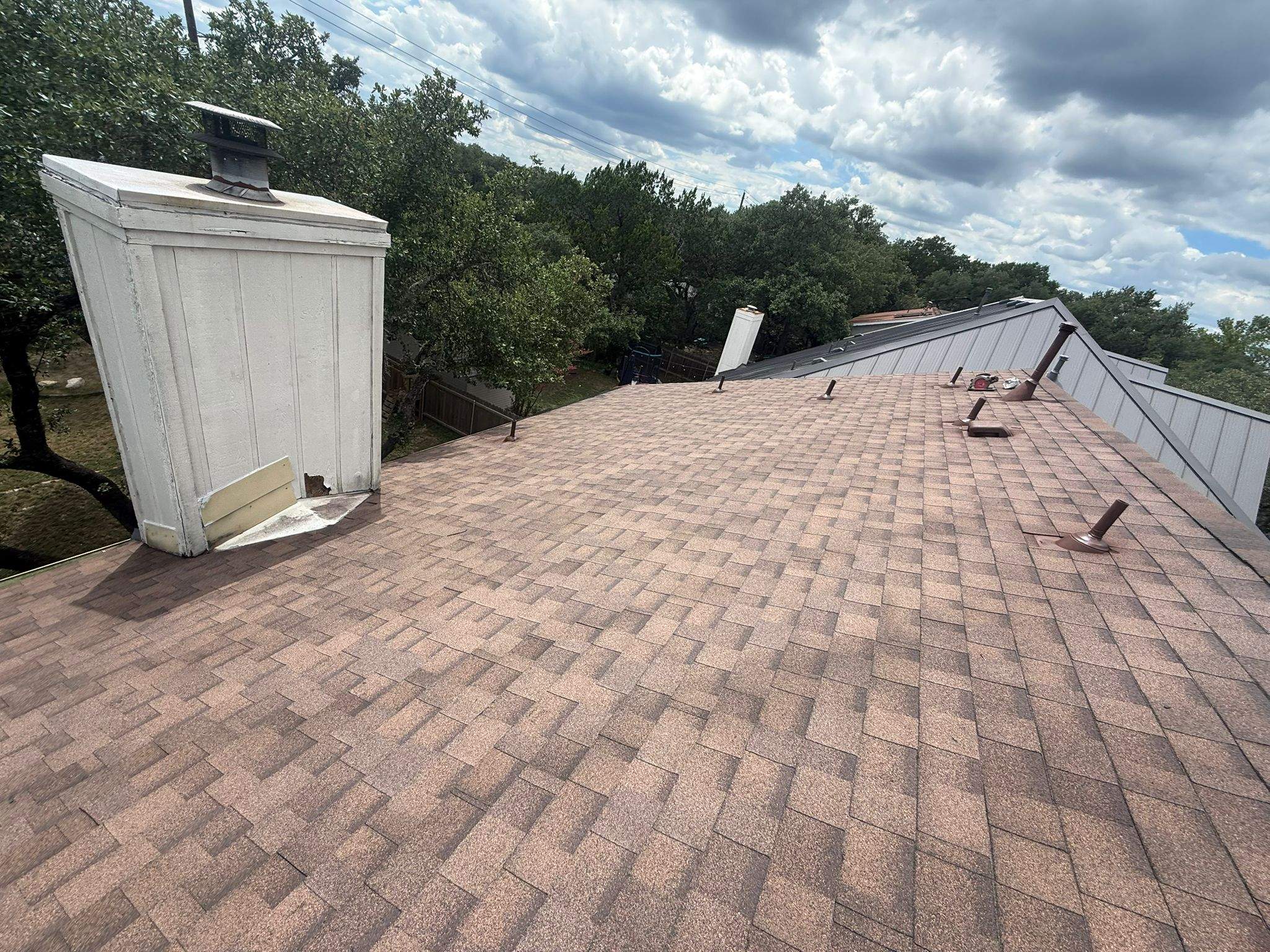 Residential Roofing Replacement and Chimney Flashing Repair in Austin by Caliber Restoration LLC