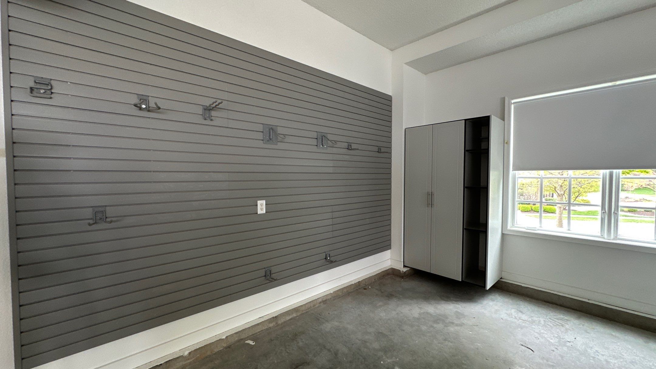 Brooke L. added cabinets for a clean storage look by Banner Garage