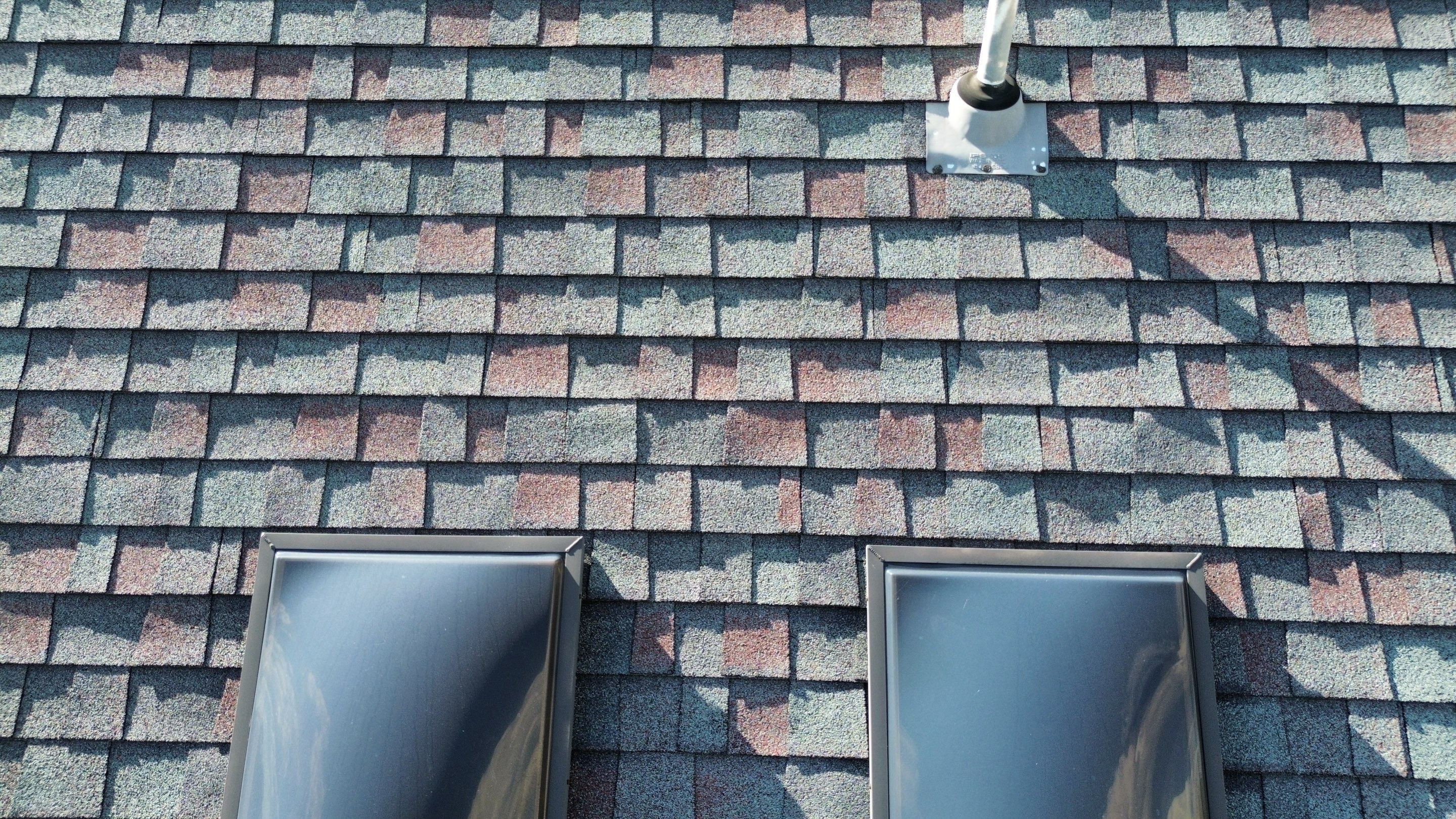 Architectural Shingle Roof Replacement and Skylight Installation in Sulphur by BANA Roofing and Solar Supply