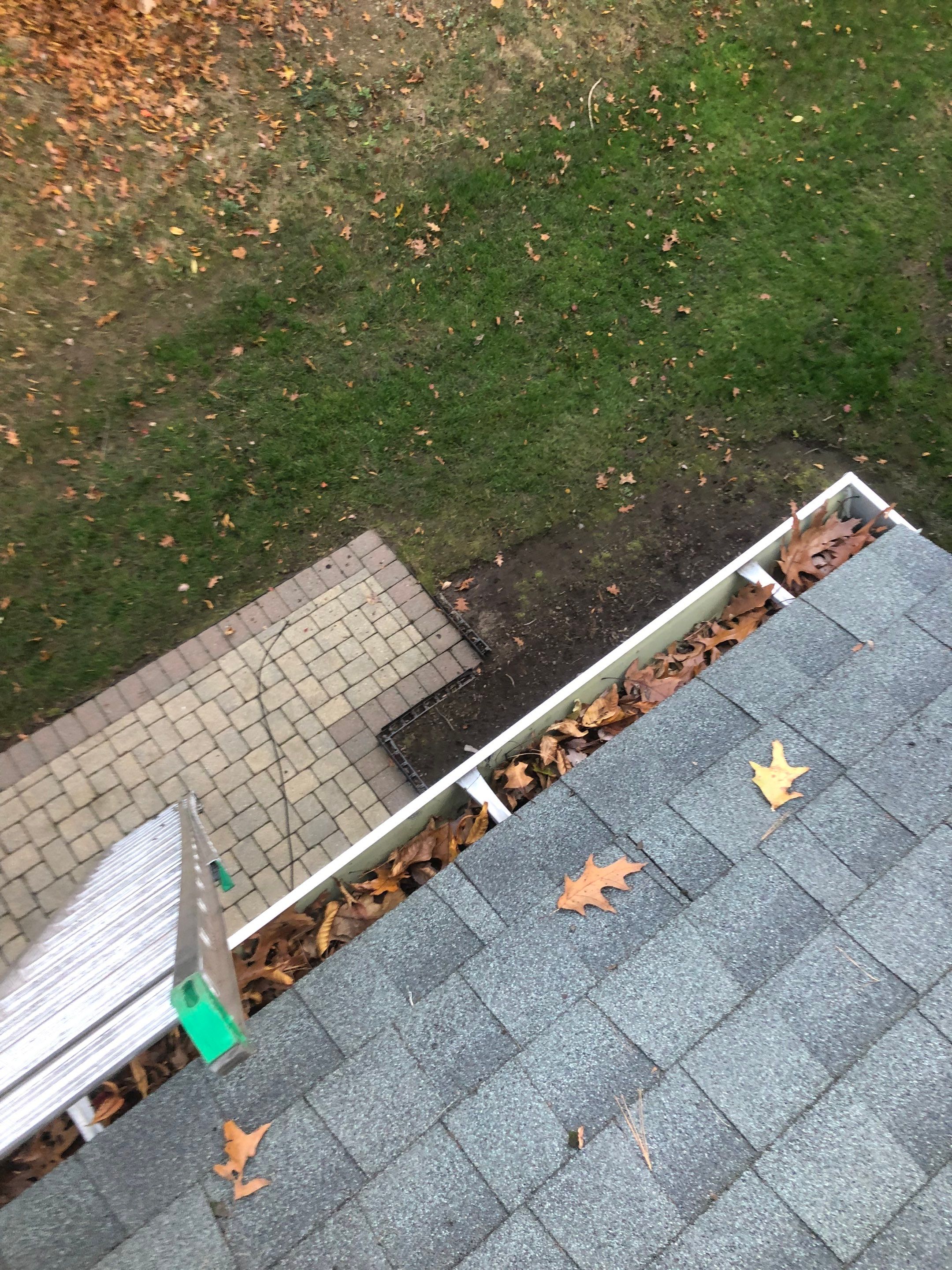 Commercial gutter cleaning Connecticut before photo with filled gutters