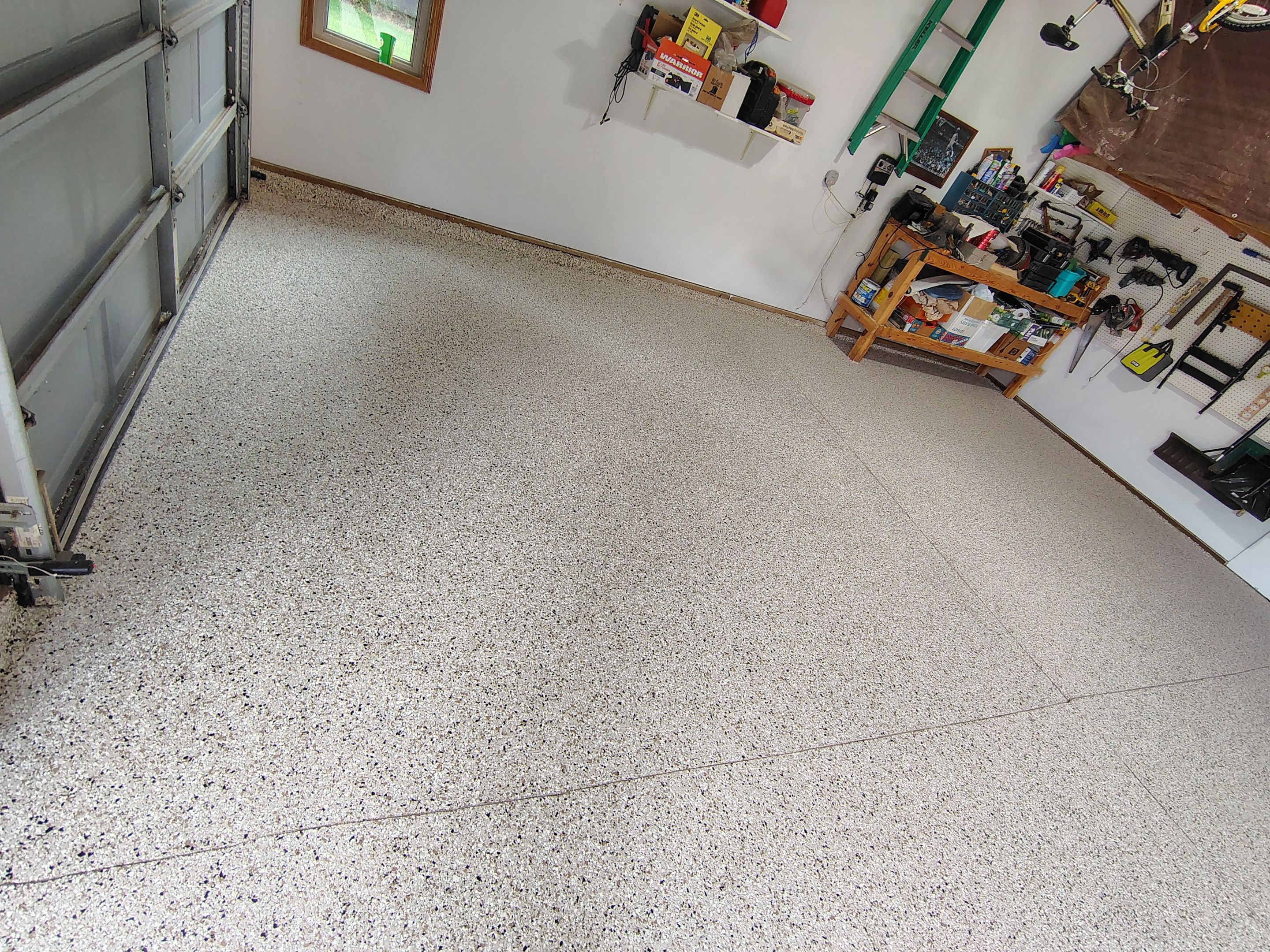 Durable Garage Floor Coating in Brandon by Select Painting, Coatings & Garage Cabinets