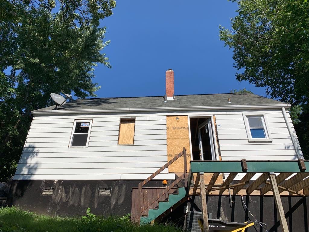 Room addition on the second floor of house by Greenspring Construction Services