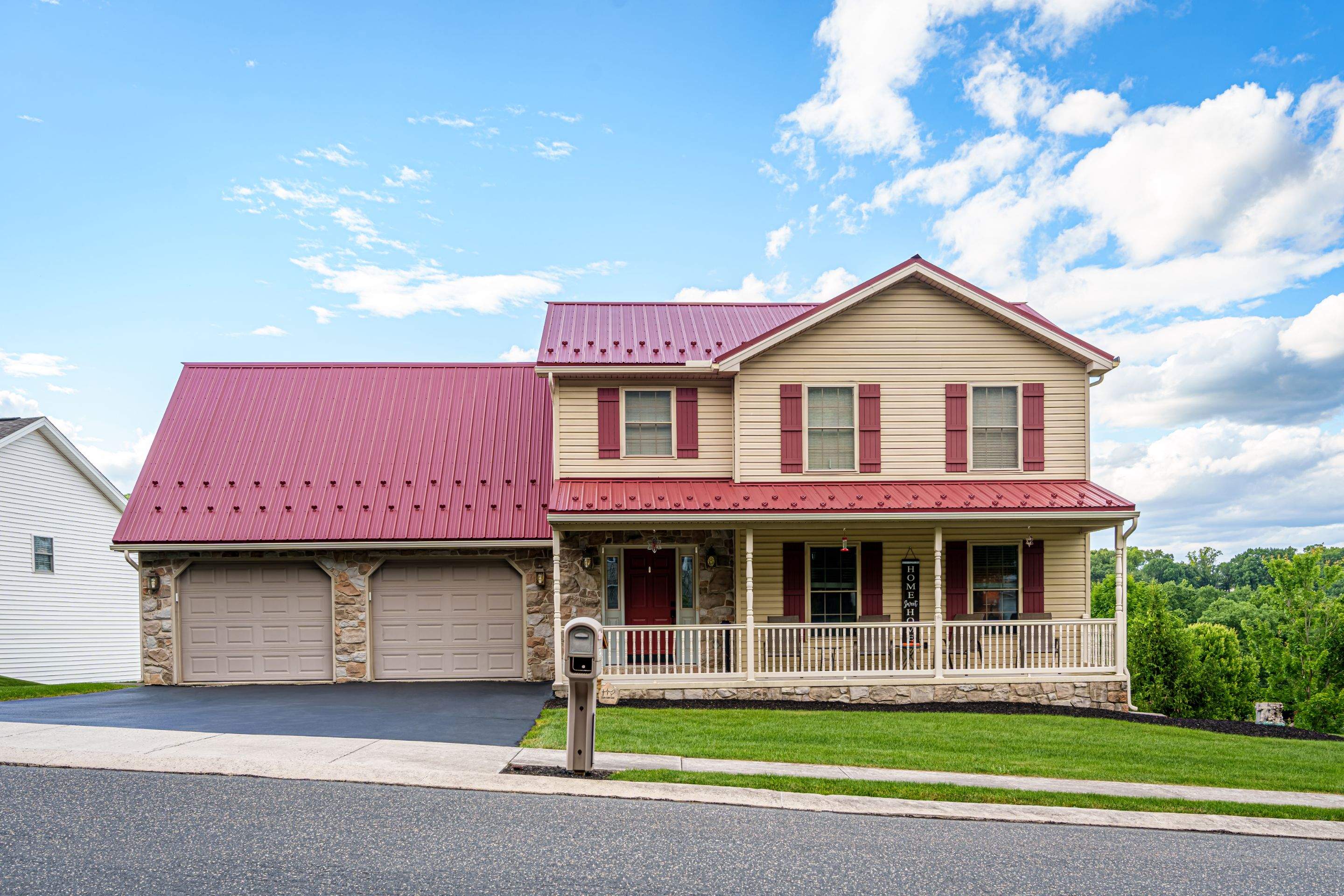 Metal roof-colonial red by Esh Builders