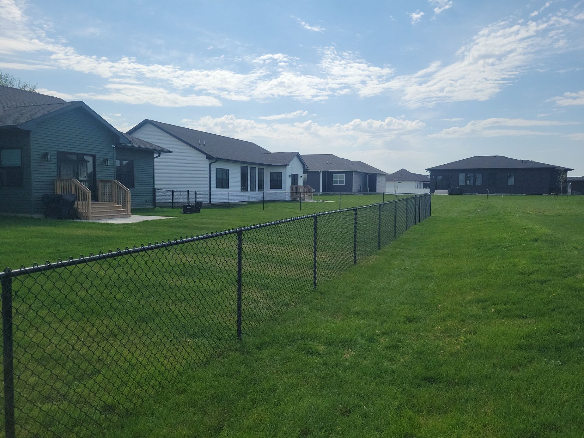 Black Chain Link Fence and Gate Installation in Cedar Falls by Perfect Picket Fence and Stain