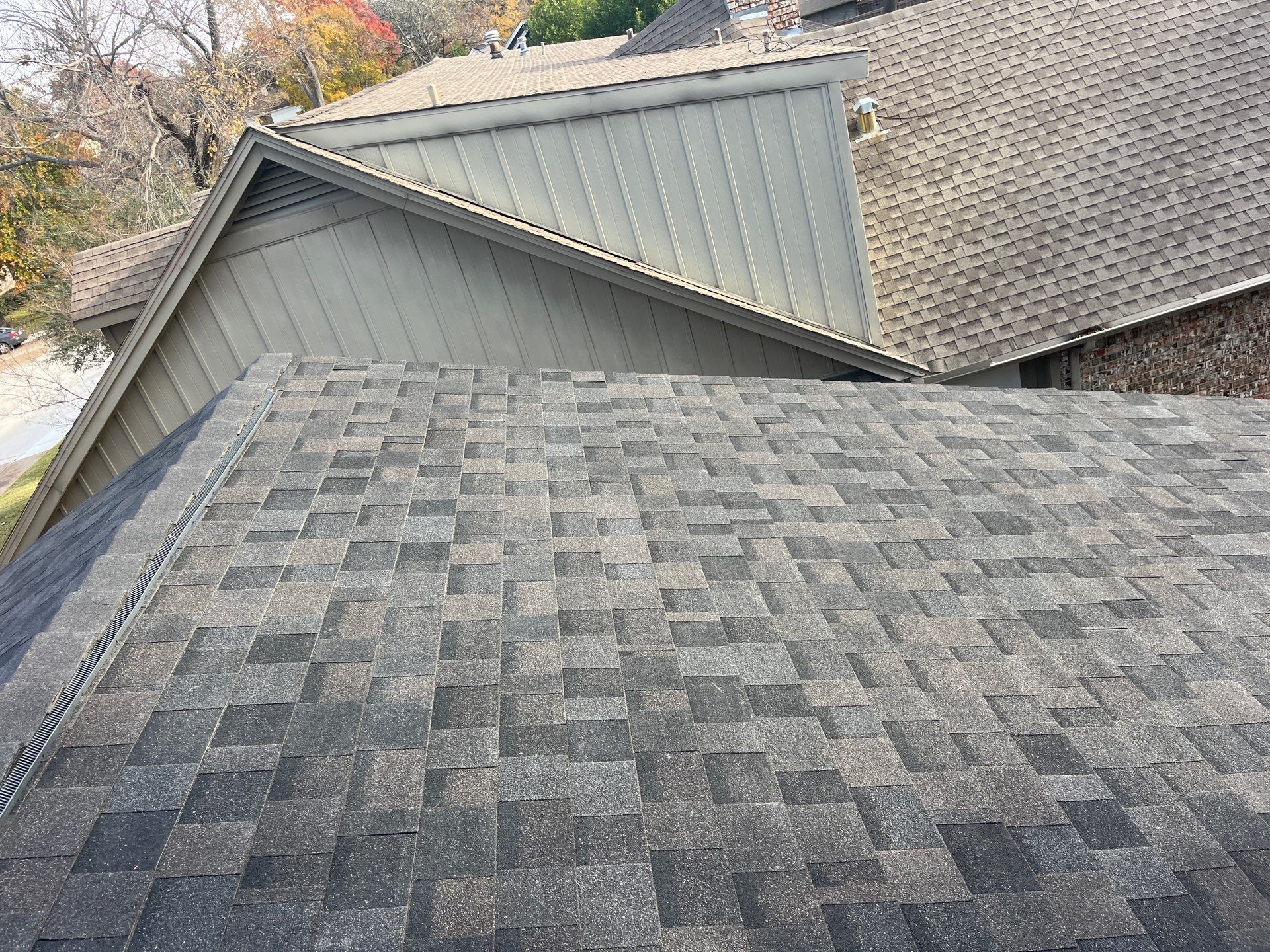 IKO Brownstone- White Brick  by Tejas Roofworks + Restoration