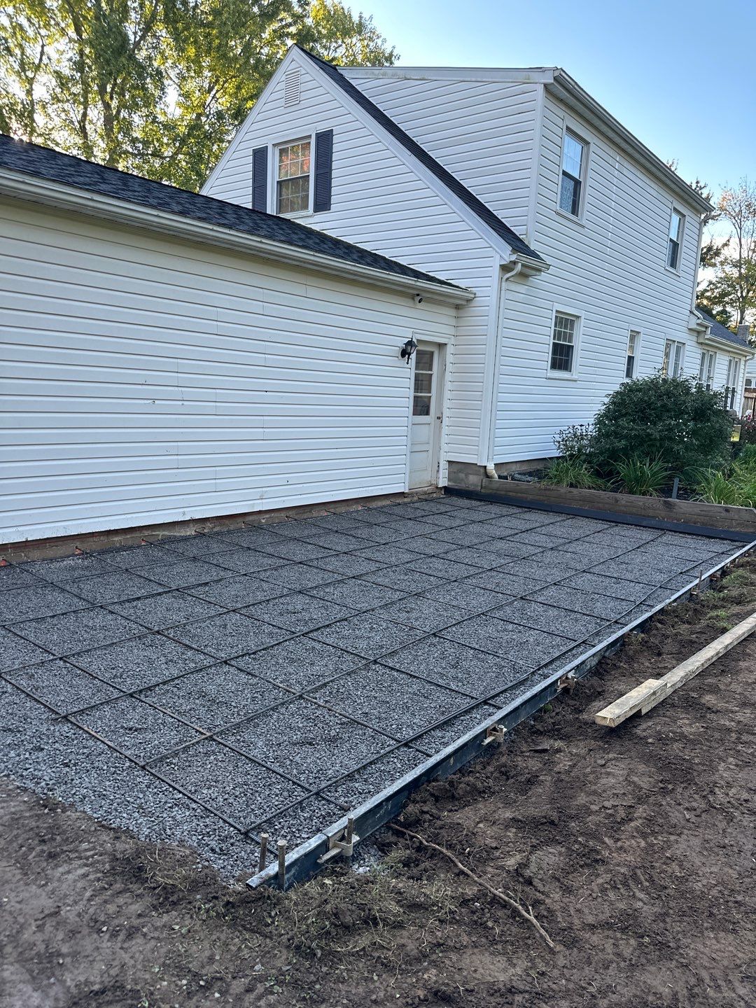 Majestic Ashlar stamped concrete patio with a border  by NG Masonry & Construction LLC