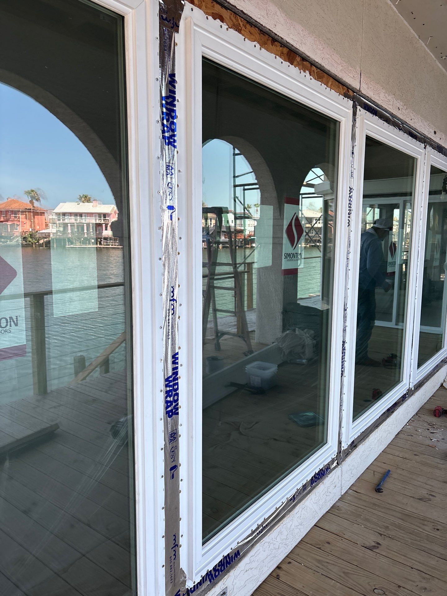 Installing Windows on a Submarine  by Bayfront Roofing and Construction