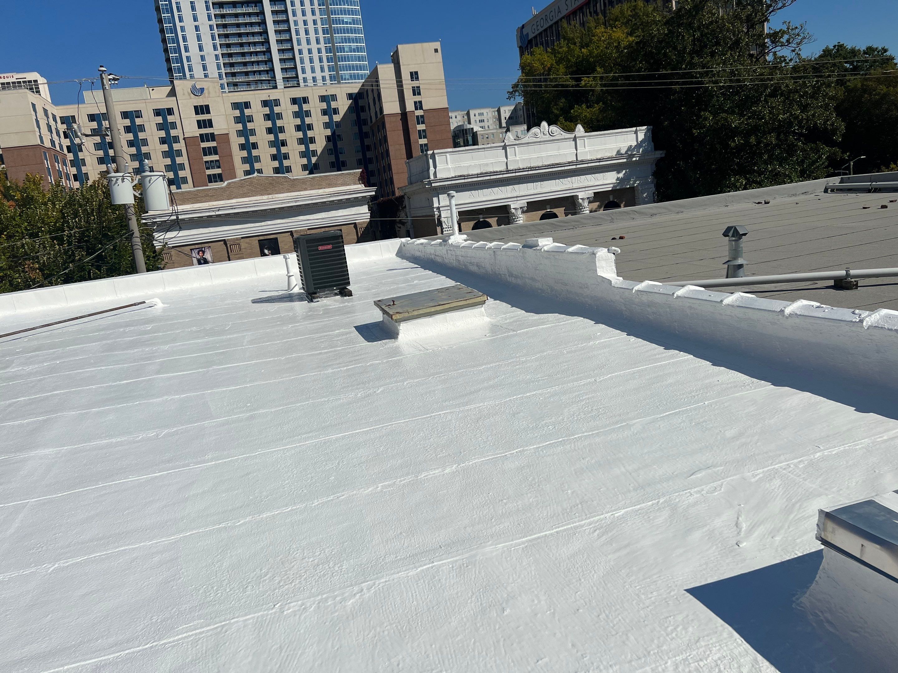 Commercial Roofing Coating using Everest Silicone Coating by Georgia Roof Advisors