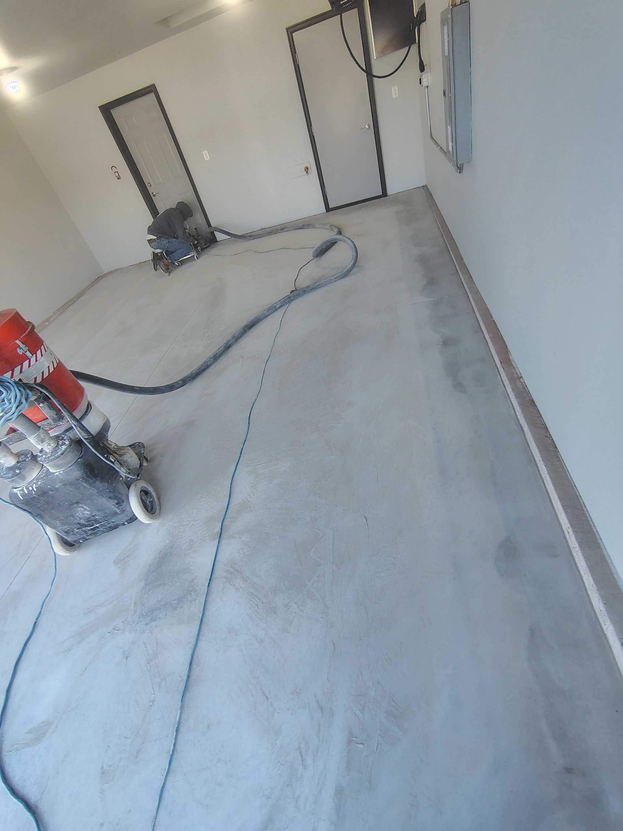 Custom Epoxy Garage Floor Coating Installation in Sioux Falls by Select Painting, Coatings & Garage Cabinets