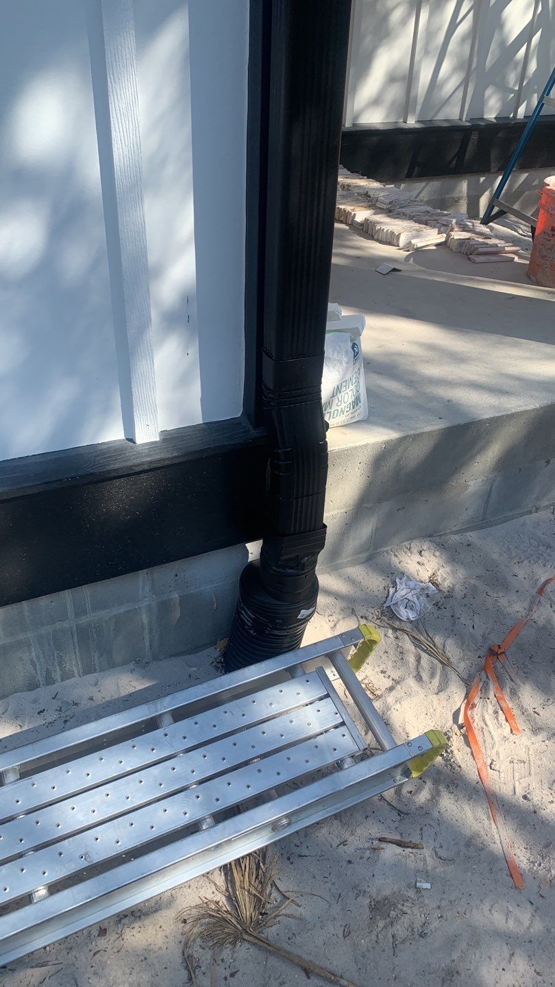 Seamless Gutter Installation Using Black Half Round Seamless Gutters by Gutter Professors