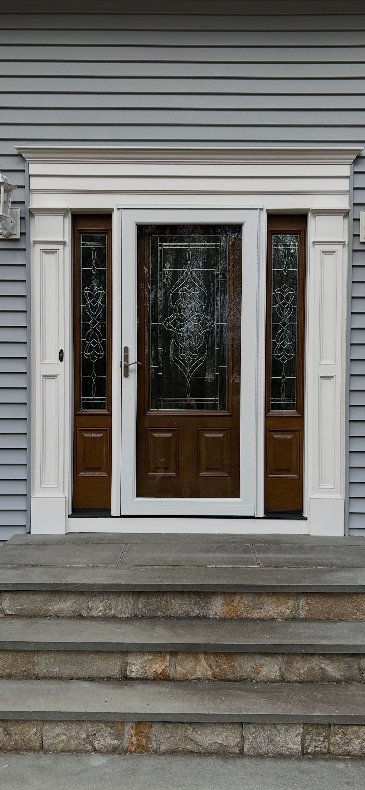 Front Entry Transformation with Decorative Glass Doors by DiGiorgi Roofing and Siding Inc
