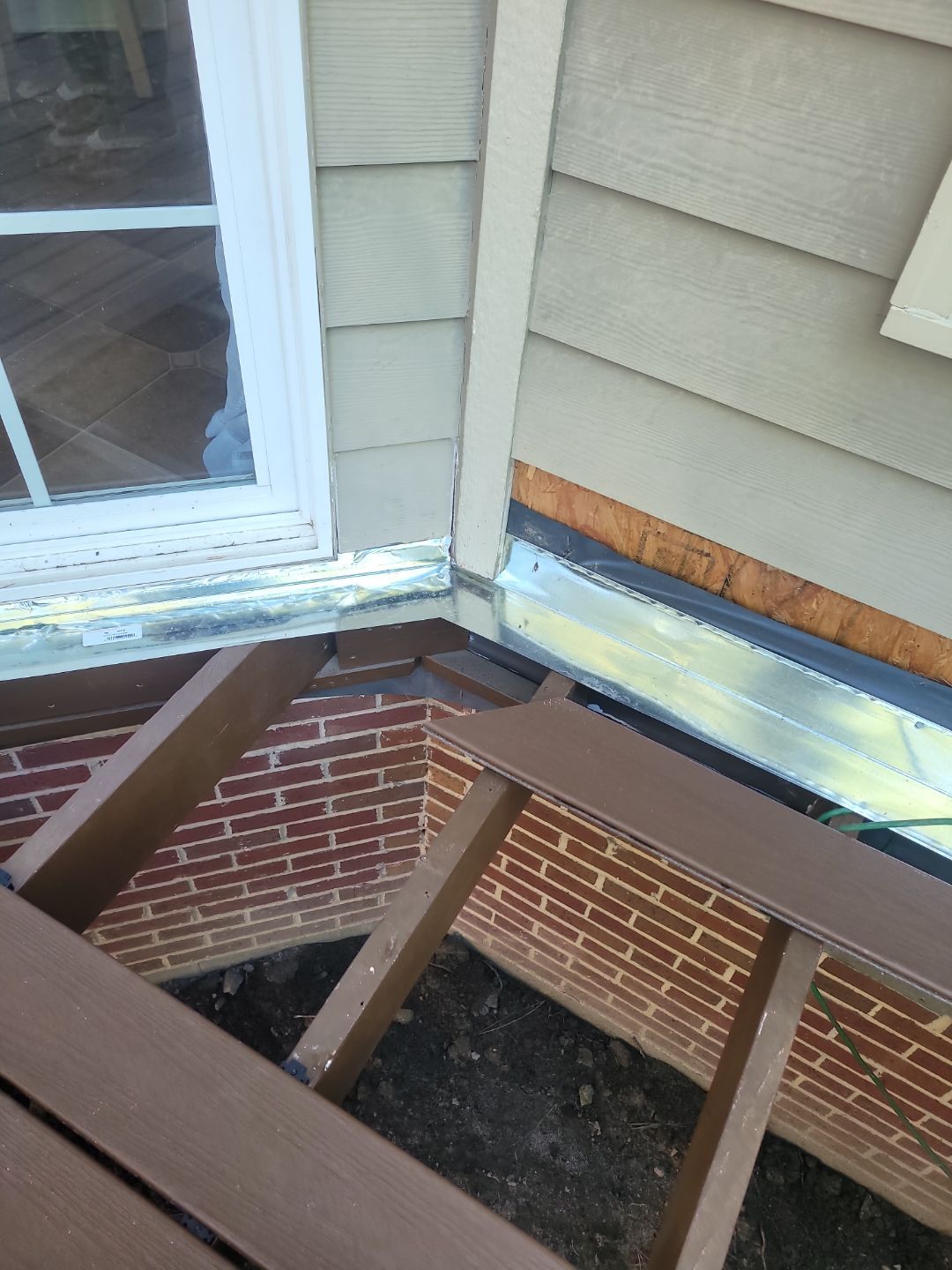 Fuquay-Varina Outdoor Upgrade – Composite Deck & Paved Landing by Elite Remodeling and Design LLC