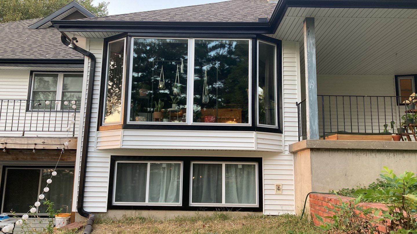 New white siding with Black trim by EEC  Windows, Siding & Roofing 