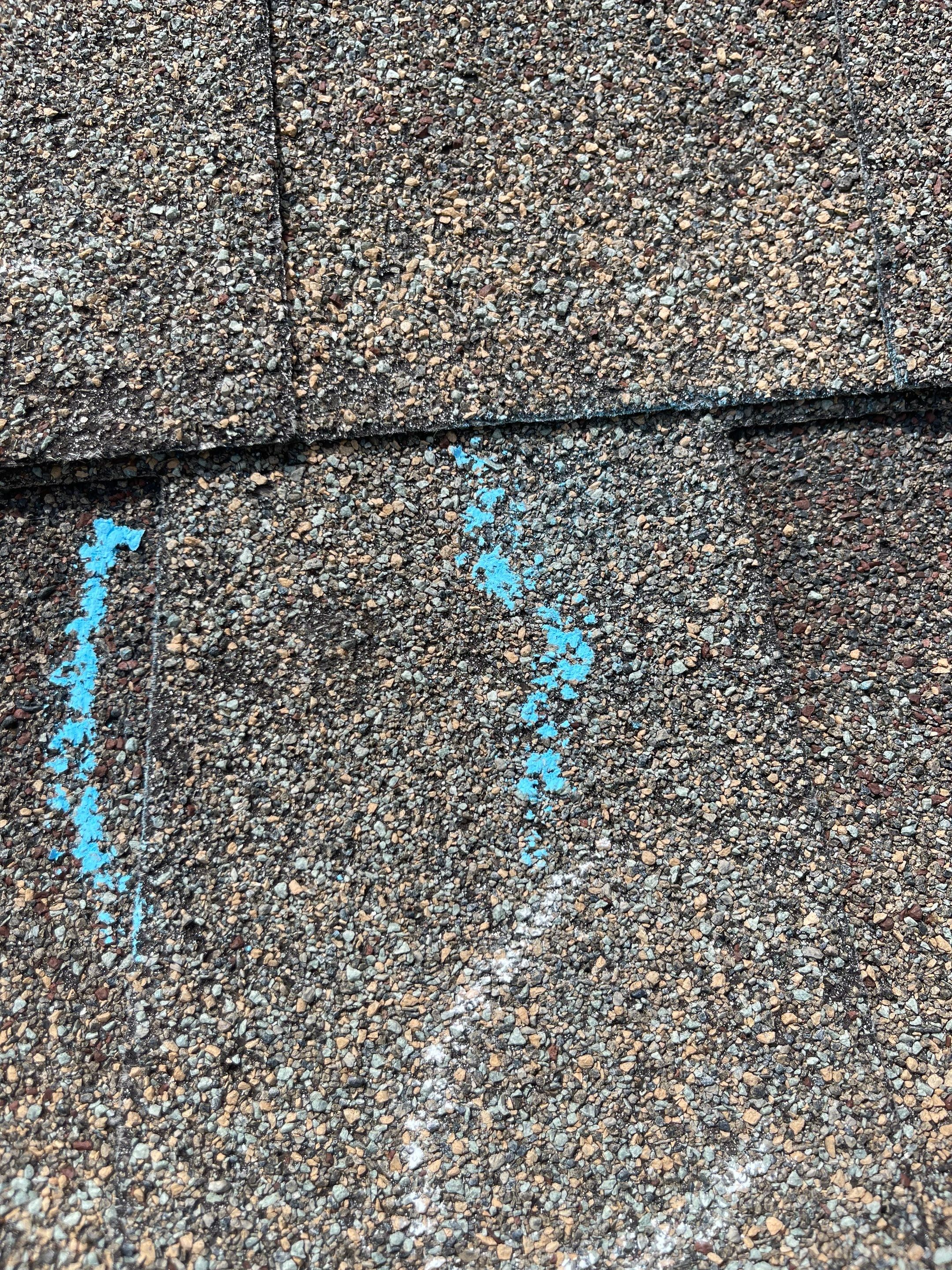 Hail Damage on a Roofing System by Icon Roofing And Construction 