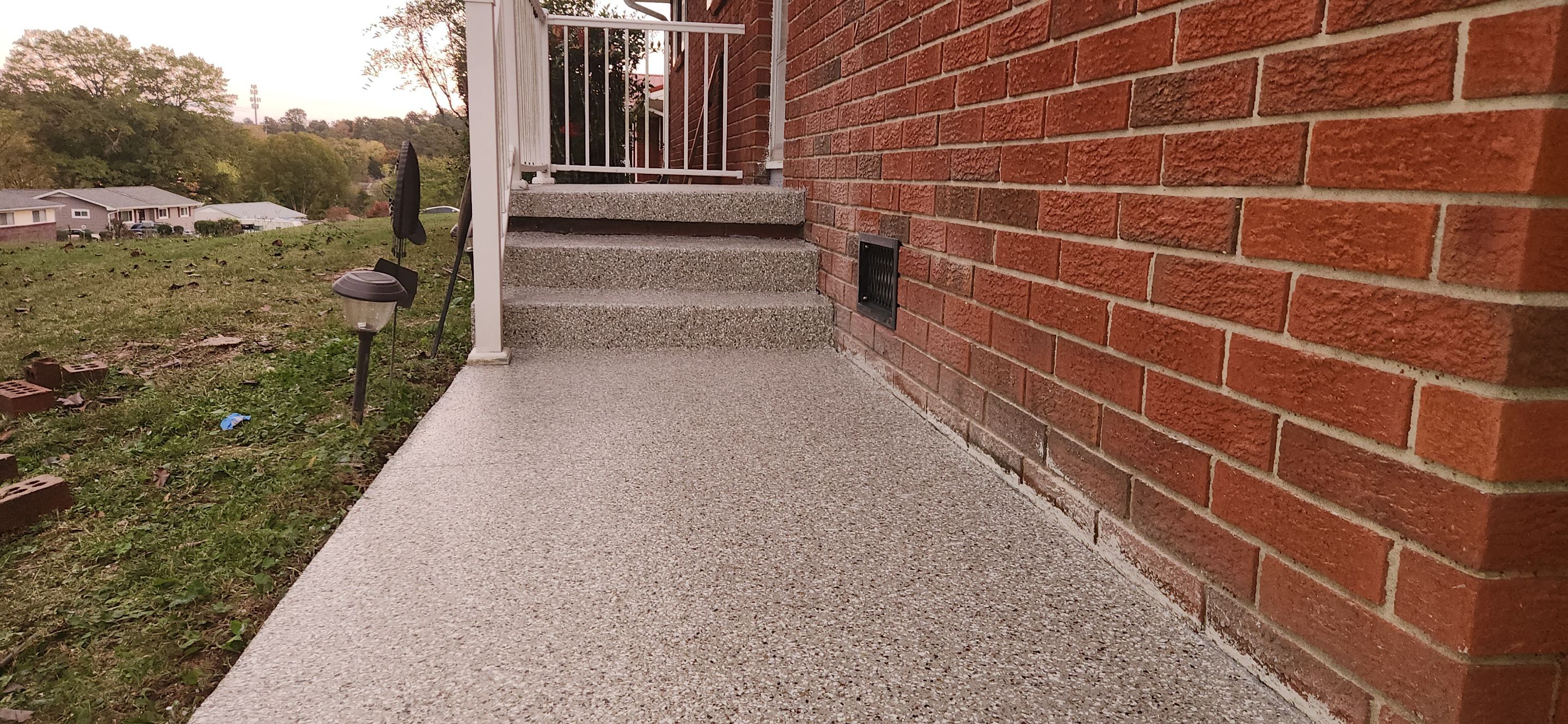 Back Patio using Creekbed by Elite Floor Solutions