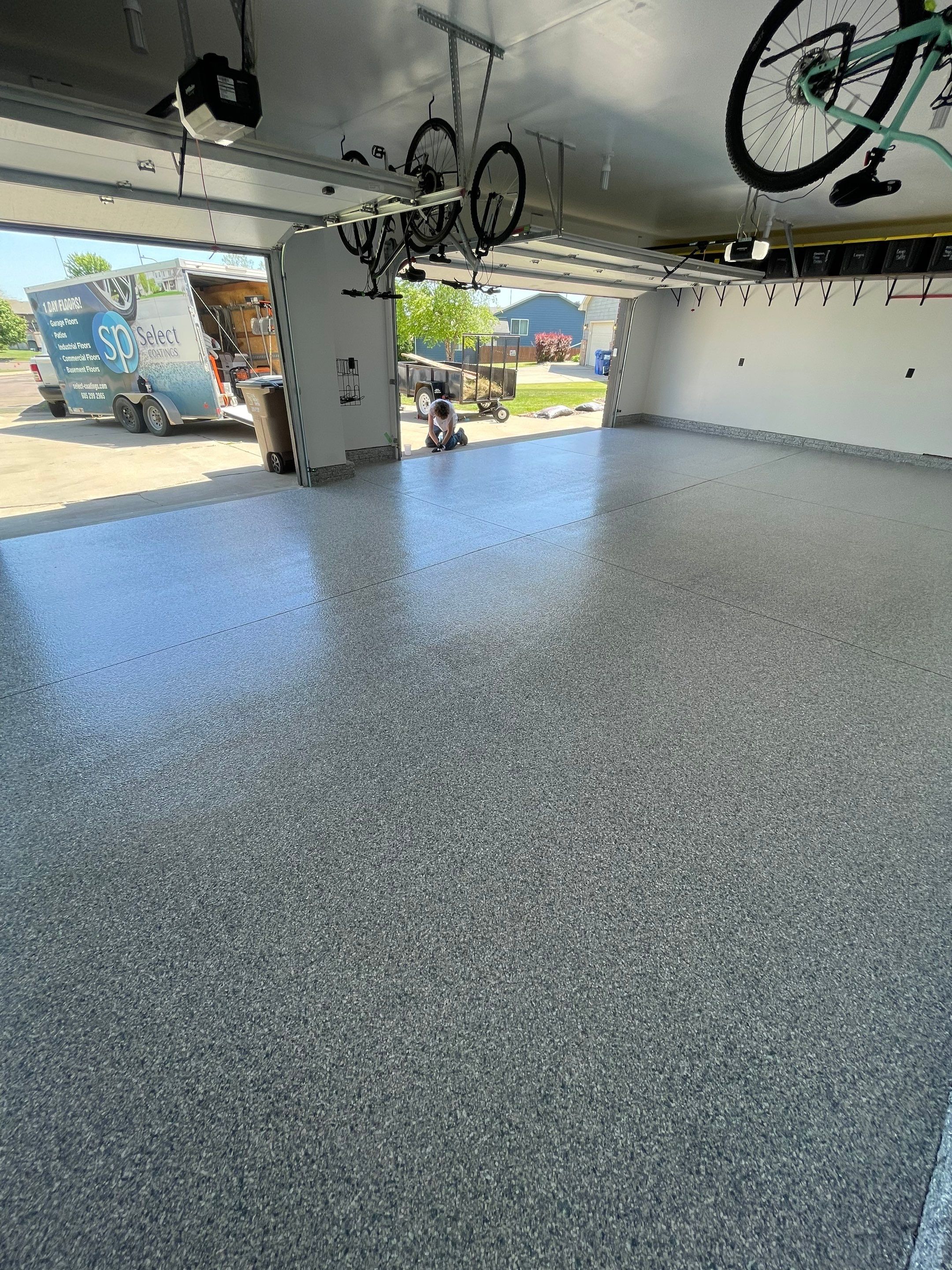 Tidal Wave Flake Garage Floor Installation in Sioux Falls by Select Painting, Coatings & Garage Cabinets