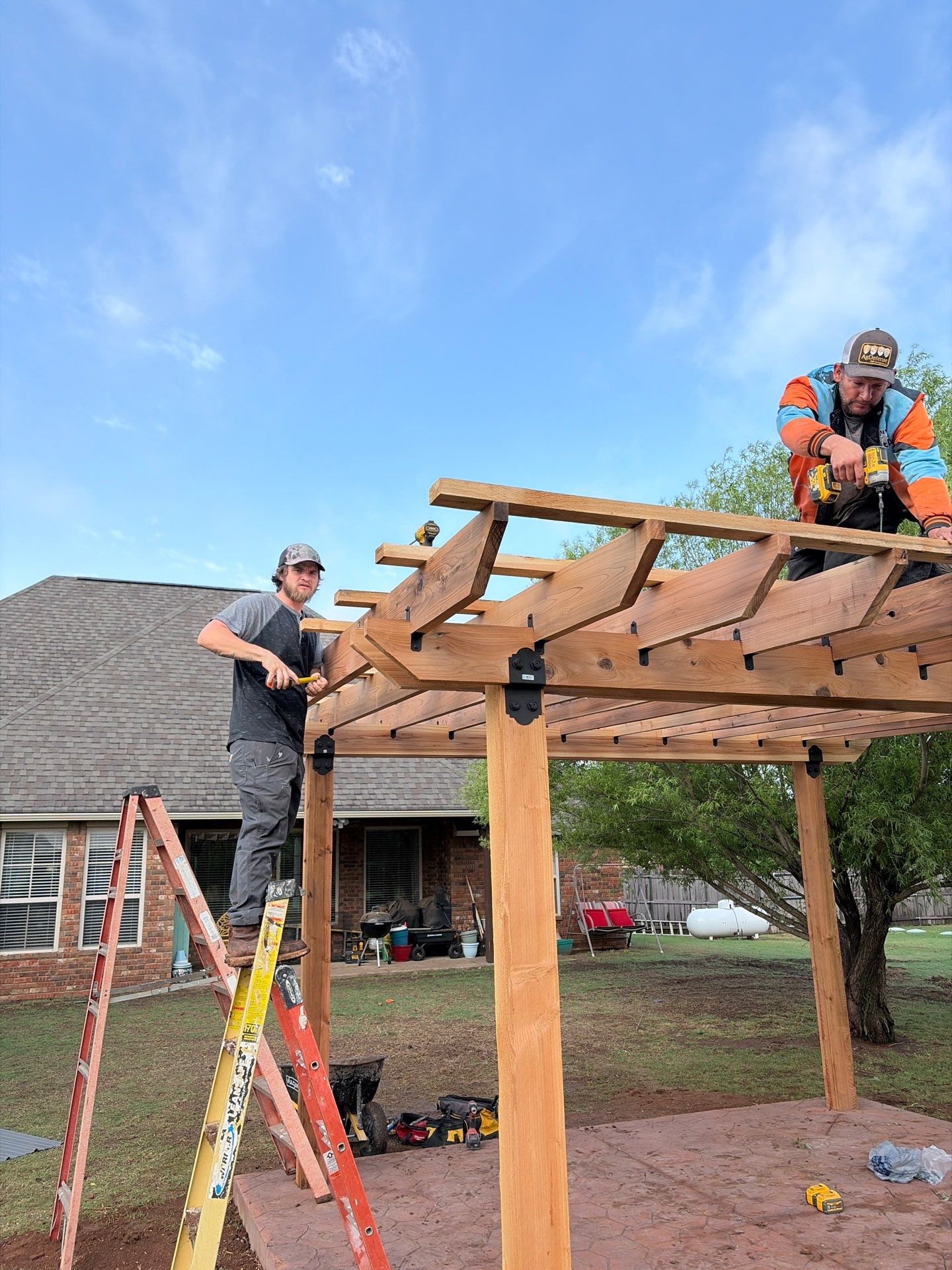 Stamped Concrete & Custom Pergola Build by Clays Services Inc