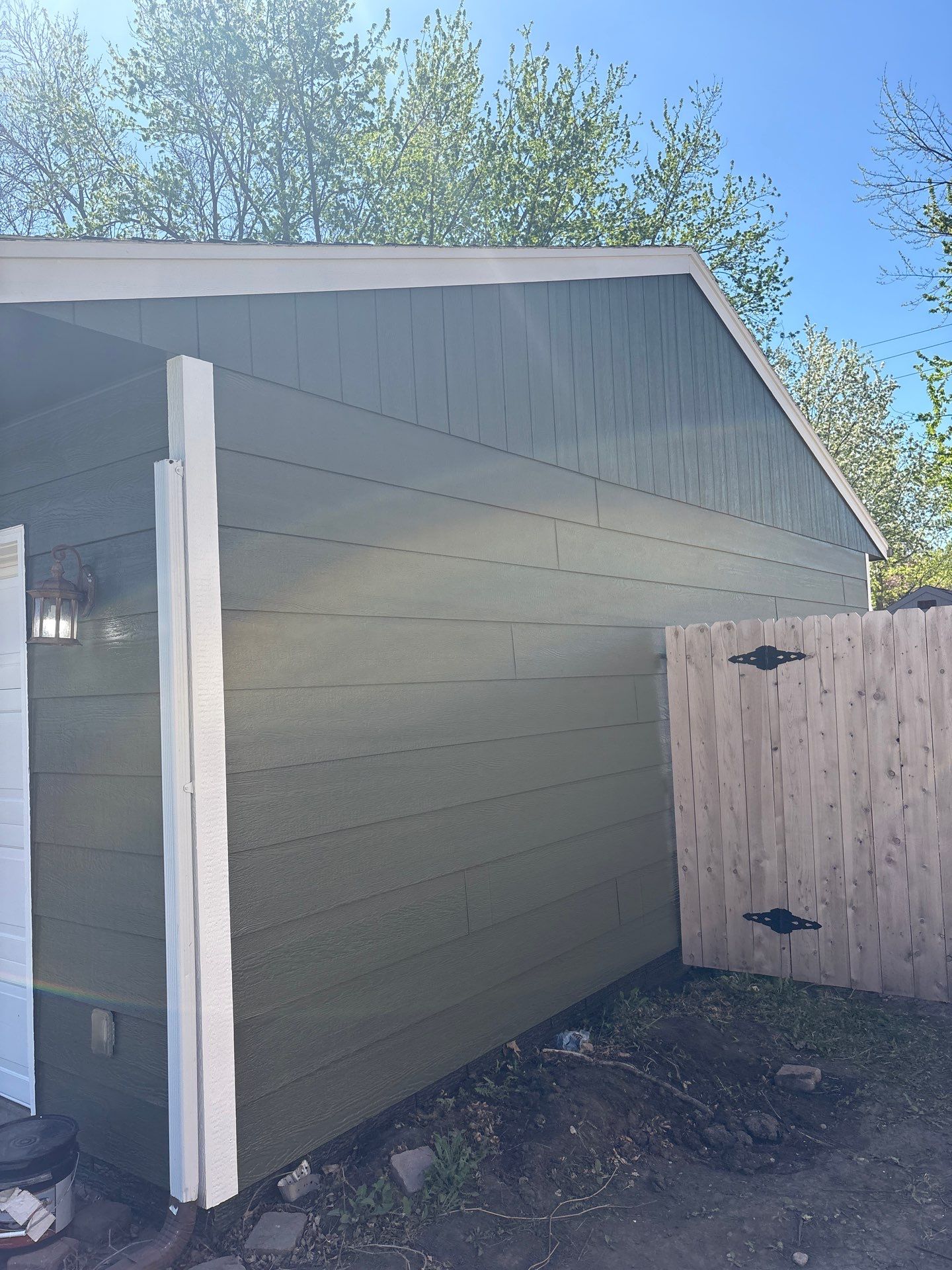 Full Exterior House Painting and Foundation Refinishing in Sioux Falls by Select Painting, Coatings & Garage Cabinets