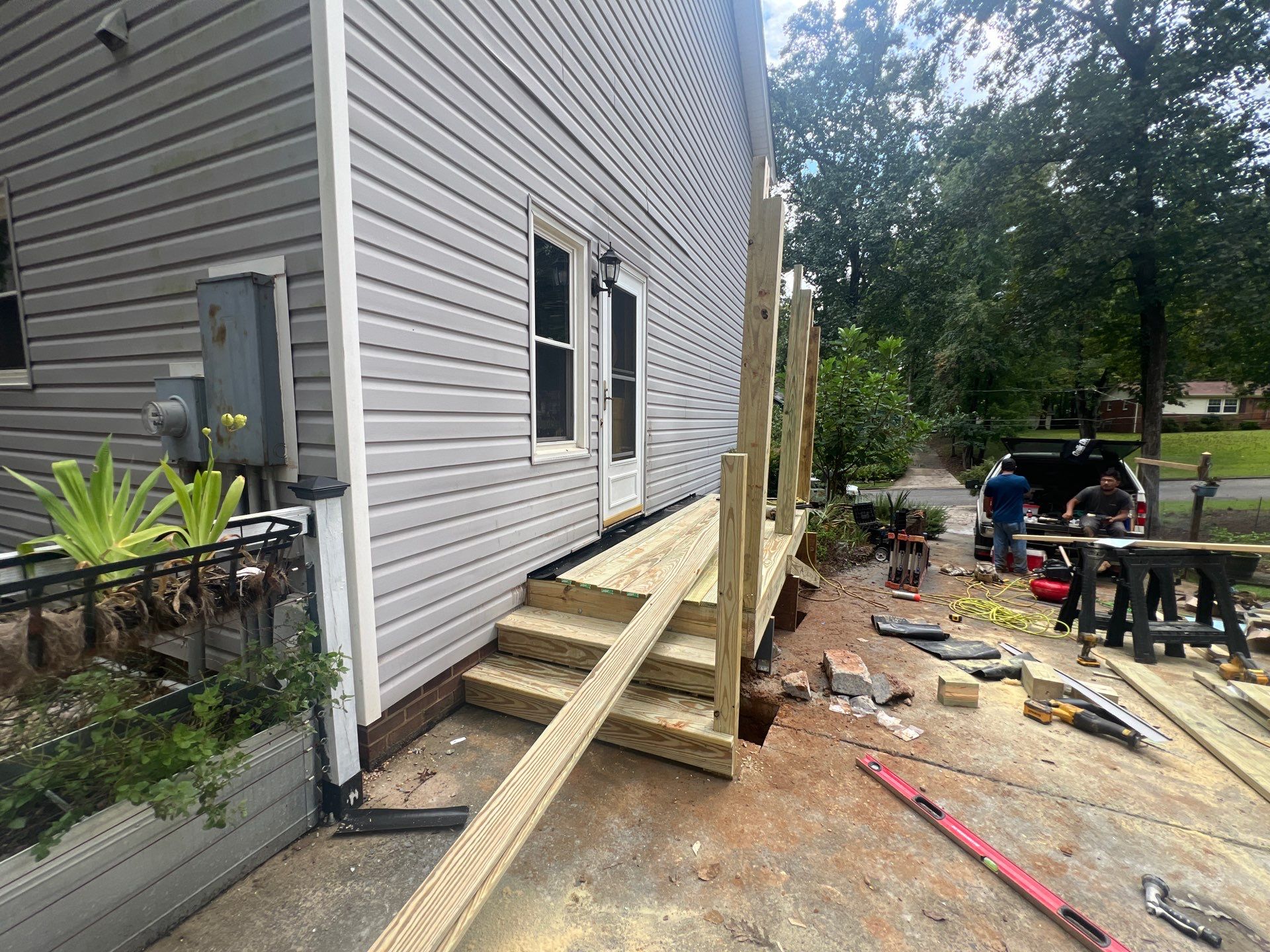 Custom Pressure-Treated Deck and Metal Roof Installation in Durham by The Remodeling Company