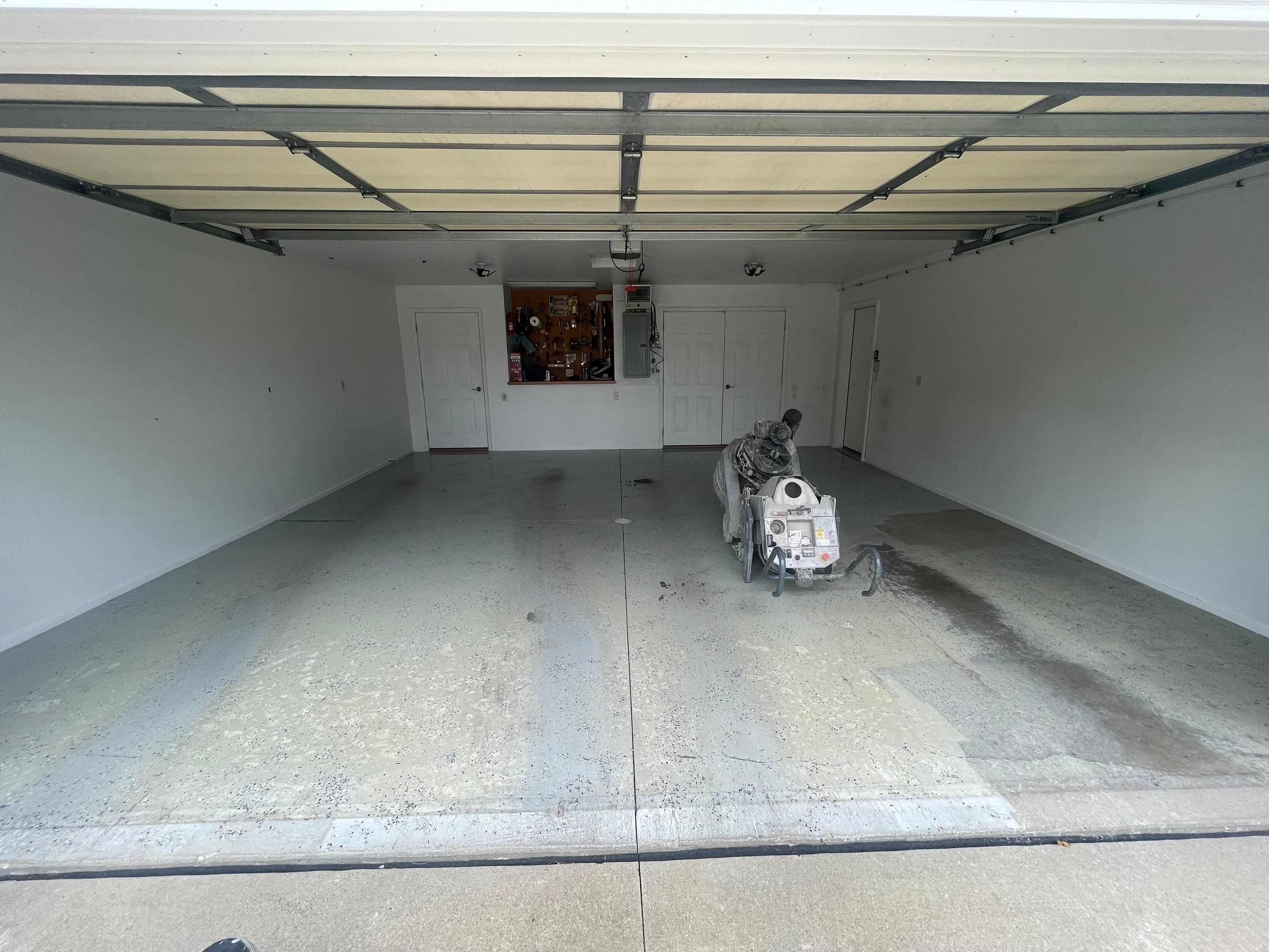 Coyote Flake Garage Floor Coating in Worthington, Minnesota by Select Painting, Coatings & Garage Cabinets