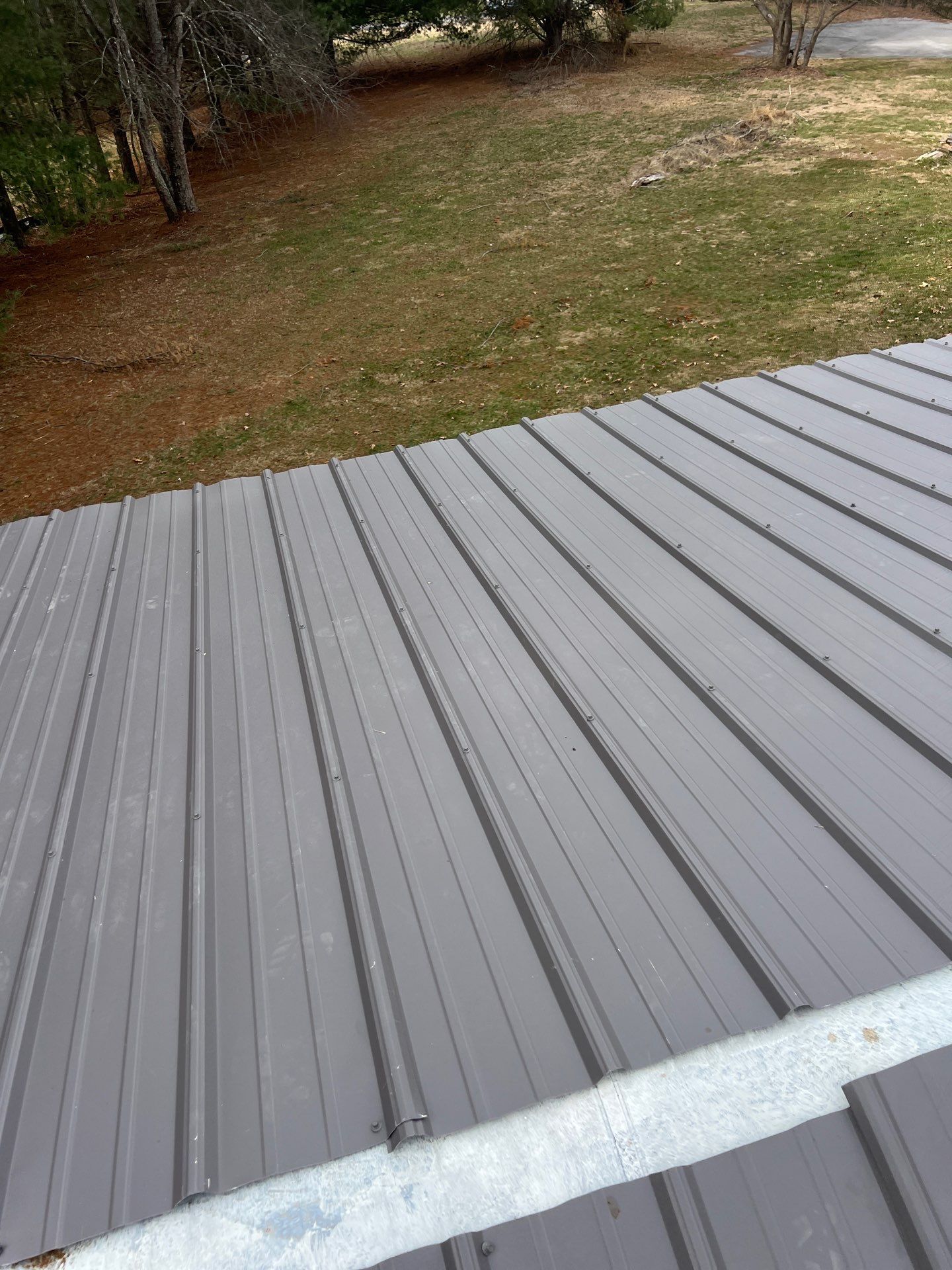 Textured Charcoal Gray using 29 Gauge AG Panel by Omnia Roofing