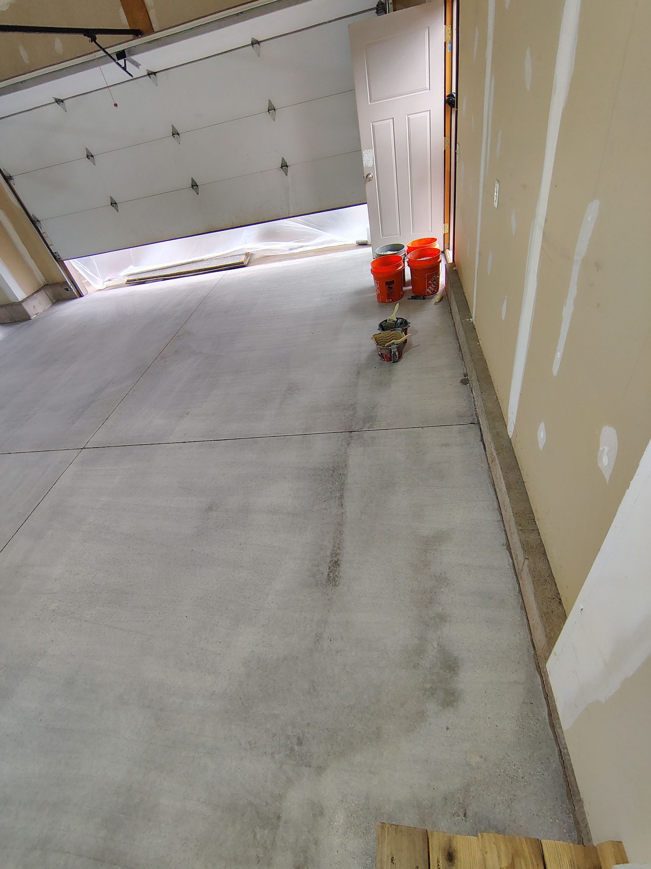 Multi-Car Garage Concrete Coating and Epoxy Finish in Sioux Falls by Select Painting, Coatings & Garage Cabinets