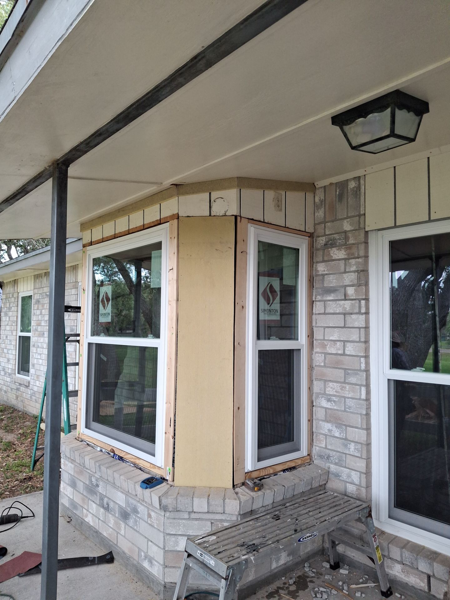 Installing Windows on a Submarine  by Bayfront Roofing and Construction